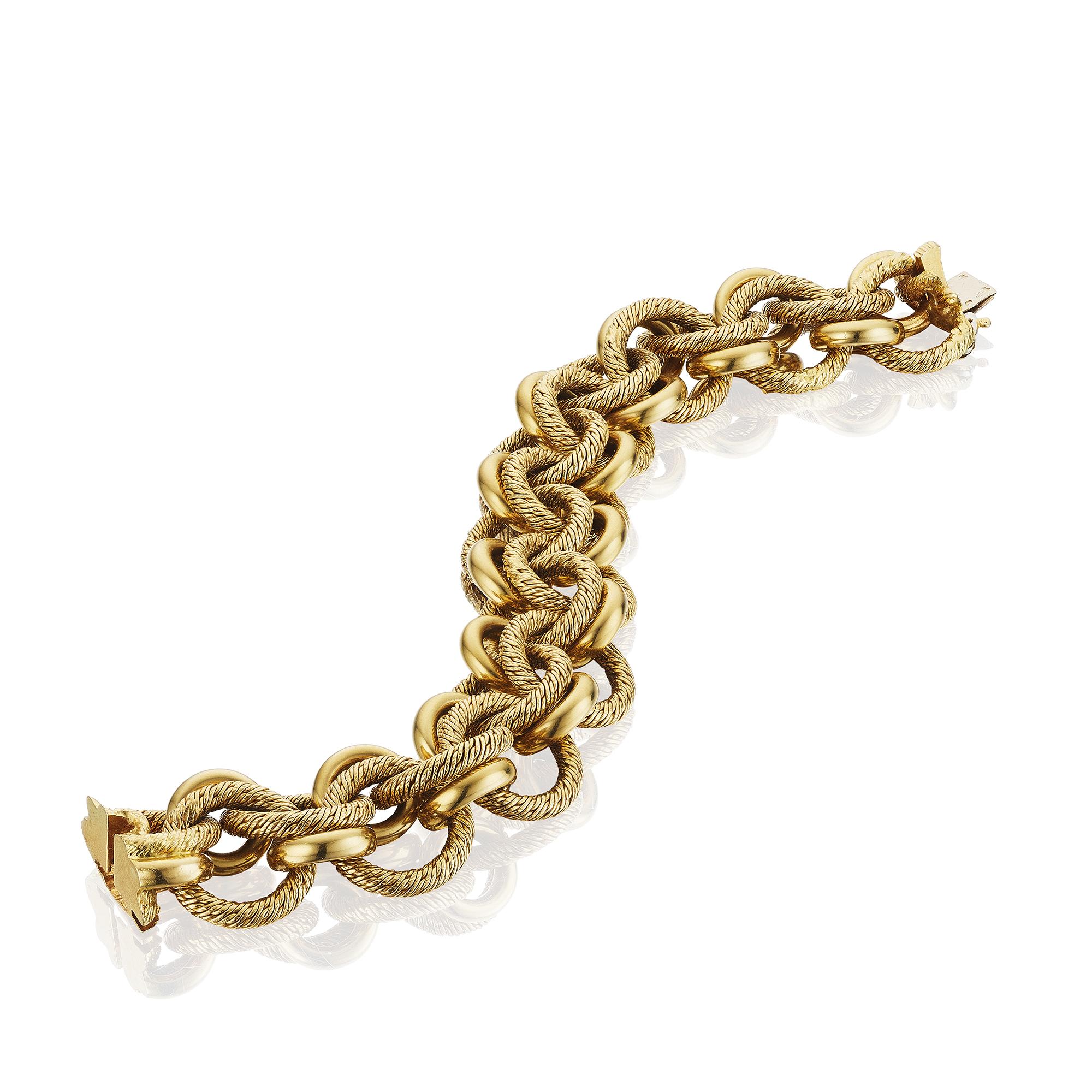 Gold Bracelet by Jacques L'enfant for Georges L'enfant, Paris, circa 1950

A bracelet composed of interlocking links of polished gold and textured gold; in 18-karat gold, with French assay marks 
• Maker's mark for Georges L'enfant

Biography
The