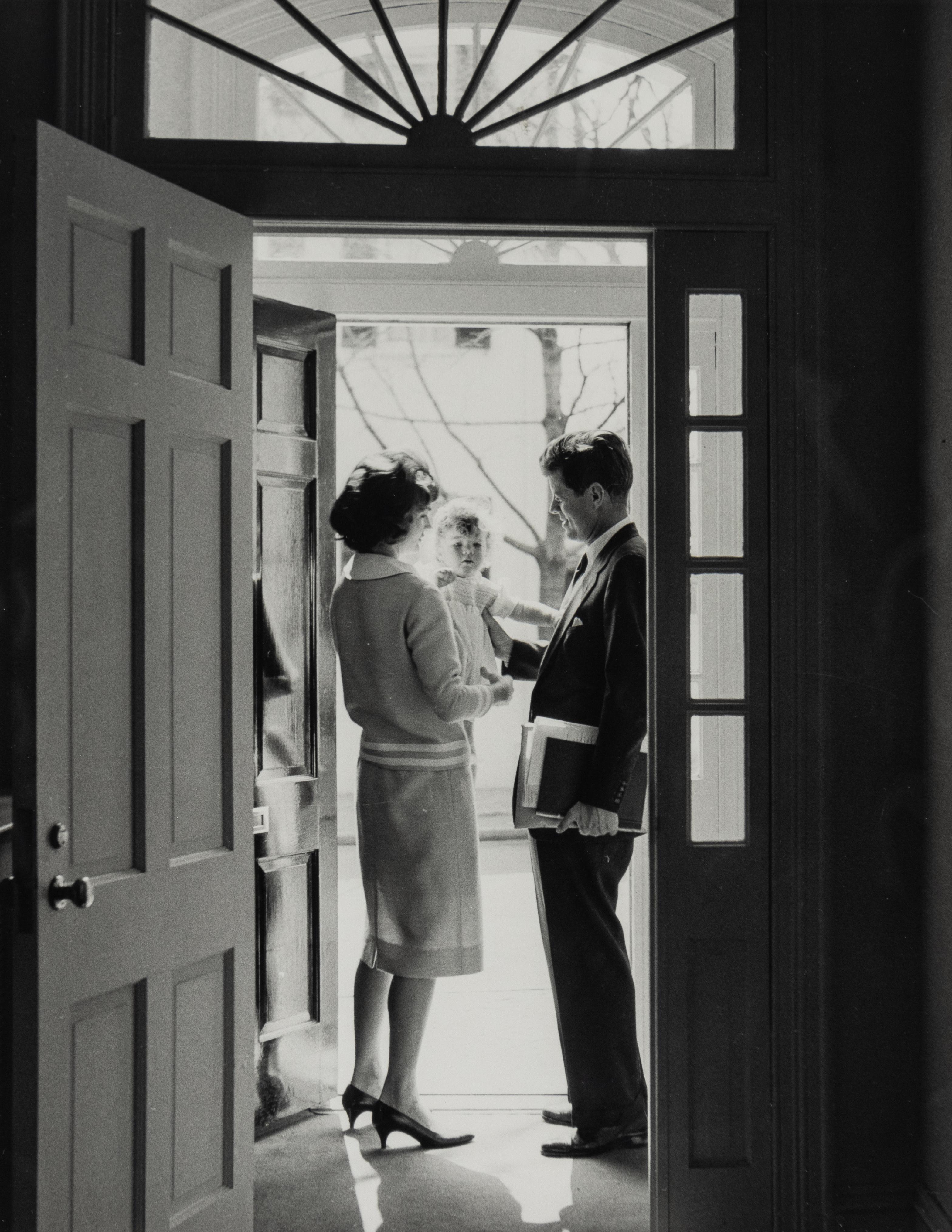 JFK with Jackie and Caroline in the Doorway of his Georgetown Home - Photograph by Jacques Lowe