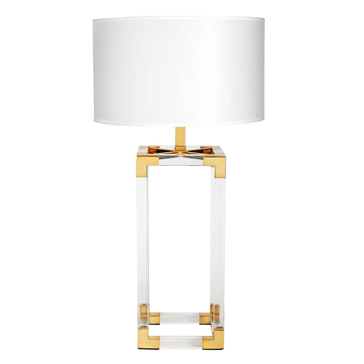 Clearly cool. The perfect blend of simplicity and glamour, modern and traditional. Our Jacques column table lamp features crystal clear acrylic framework with brushed brass corners topped with a silky white shade. Add some pop to your penthouse or