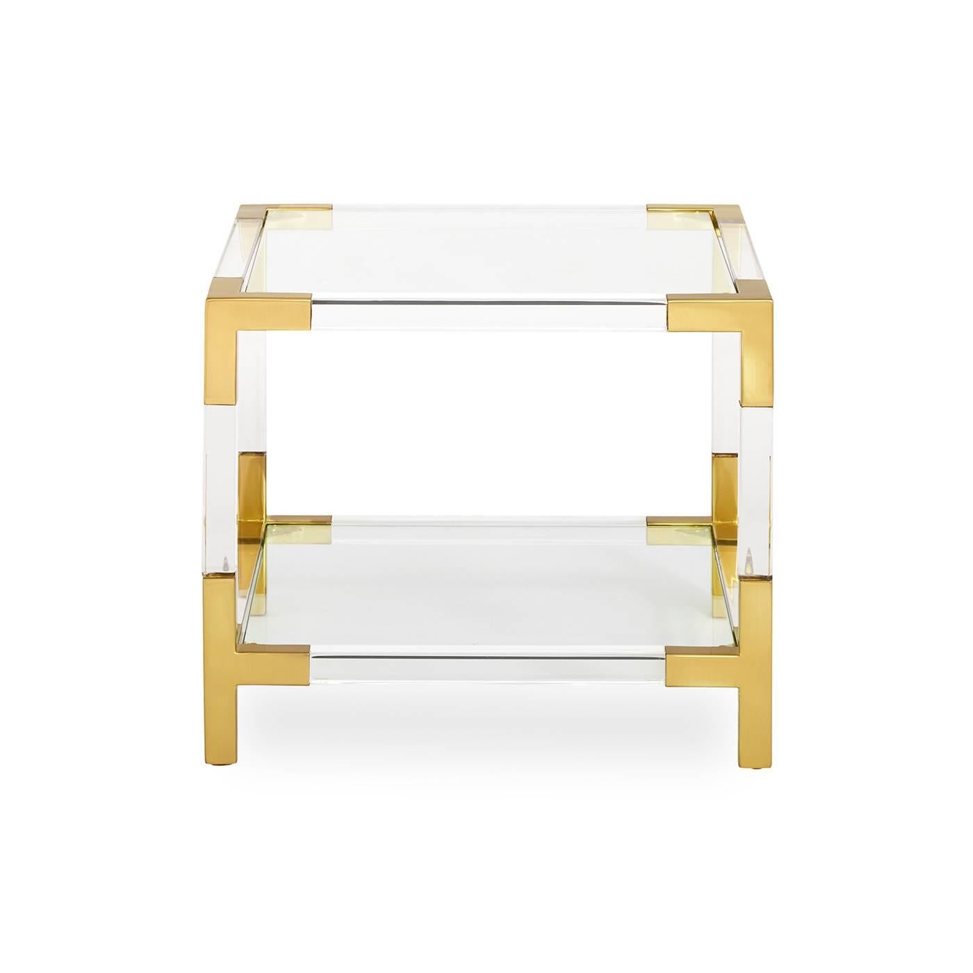 Clearly cool. Our Jacques collection is the perfect blend of simplicity and glamour, modern and traditional. In clear Lucite with brushed brass accents, this petite cube is perfect next to your sofa, by your bed, or saddled up next to your favourite