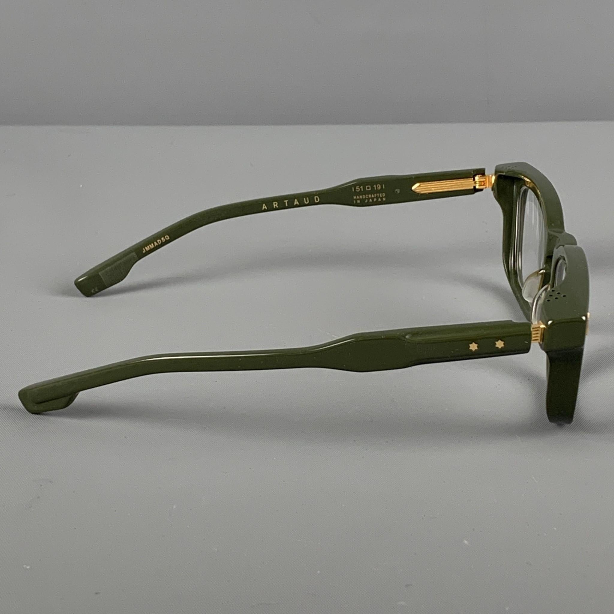 JACQUES MARIE MAGE 'Artaud' Limited Edition frames comes in a green acetate featuring gold tone accents and custom optical lenses. Includes box & case. Handcrafted in Japan.

New Without Tags. 
Marked: JMMAD5Q 51-19
Original Retail Price: