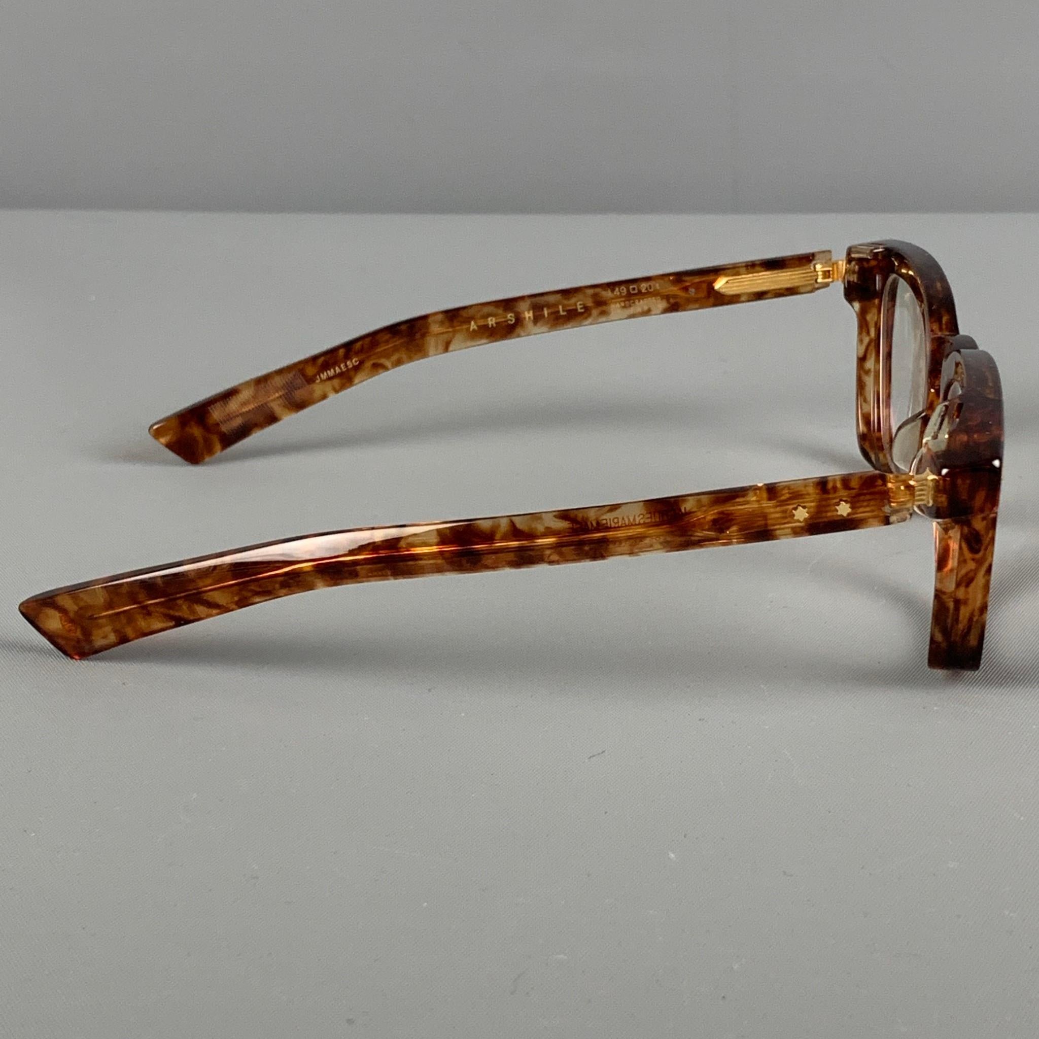 JACQUES MARIE MAGE 'Arshile' Limited Edition frames comes in a tortoise shell acetate featuring gold tone accents and custom optical lenses. Includes box & case. Handcrafted in Japan. 

New Without Tags.
Marked: JMMAE5C 49-20
Original Retail Price: