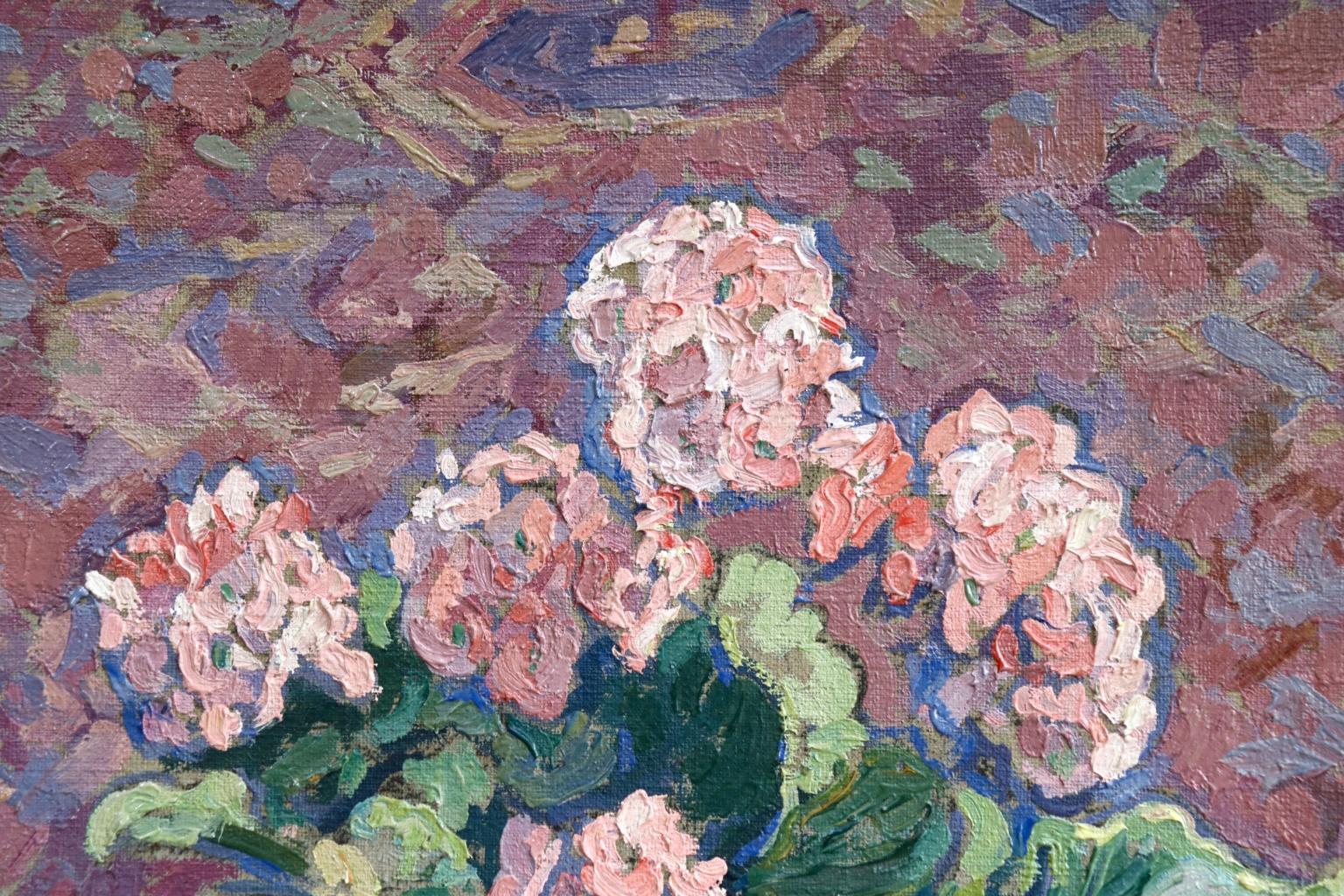 A beautifully coloured oil on canvas circa 1950 by French Post-Impressionist painter Jacques Martin-Ferrieres. The piece depicts a primrose plant with delicate pink flowers in a purple planter on a patterned rug. Signed lower right and titled verso.