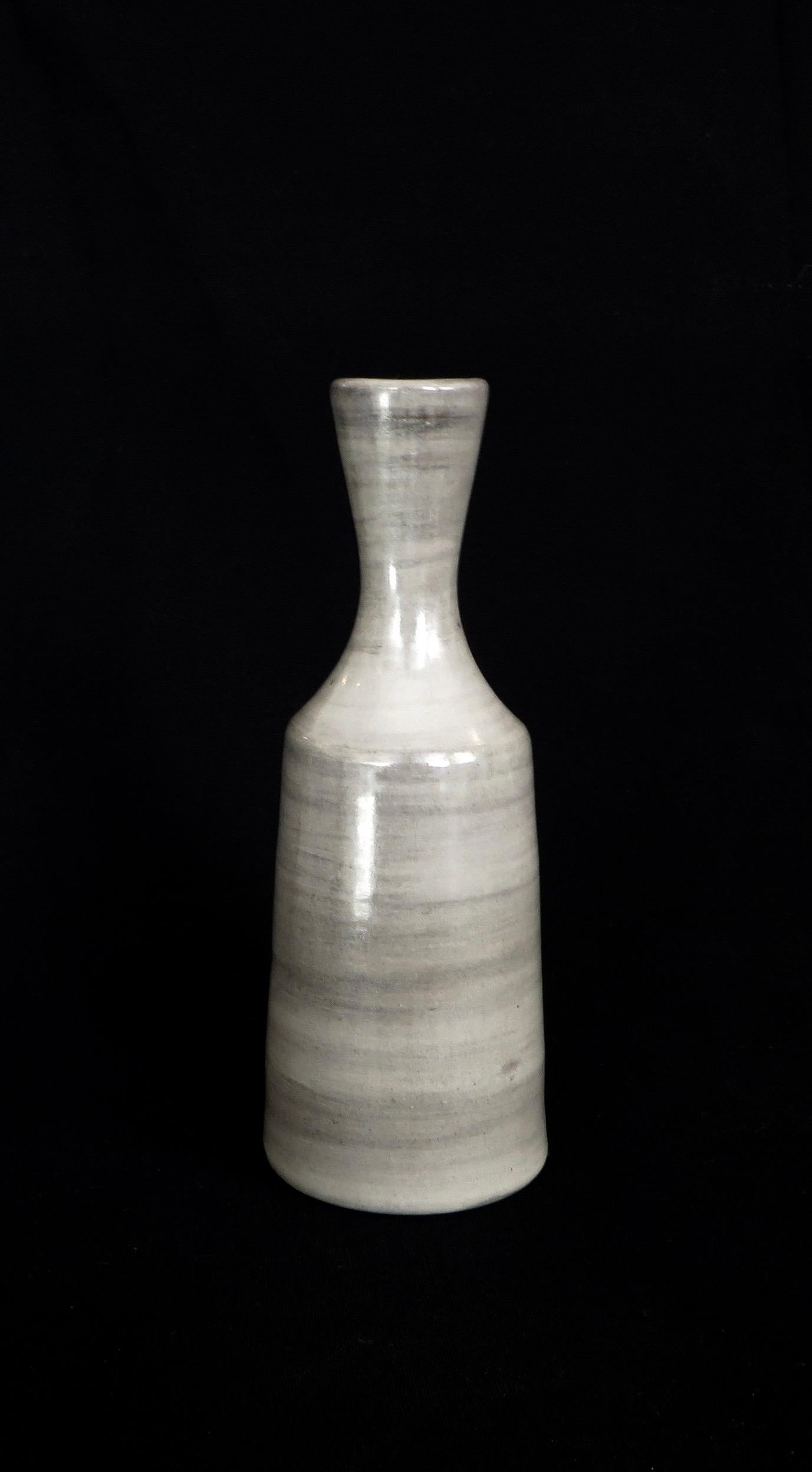 Jacques Pouchain gray small ceramic vase signed with the signature of the cavalier. 
Excellent condition. 
About the Artist: Jacques Pouchain (1925 - 2005) left Paris and gave up his architectural training in the 1950s for the South of France to