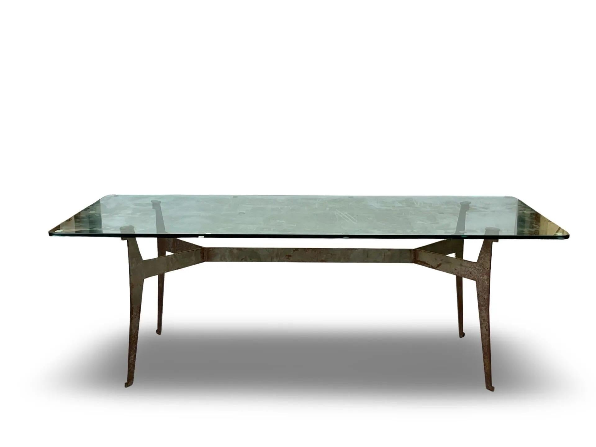 Jacques Quinet (1918-1992) attributed to, 
large table with metal base, glass top 
circa 1970
To compare with the tables reproduced in the work of Guitemie MALDONADO 