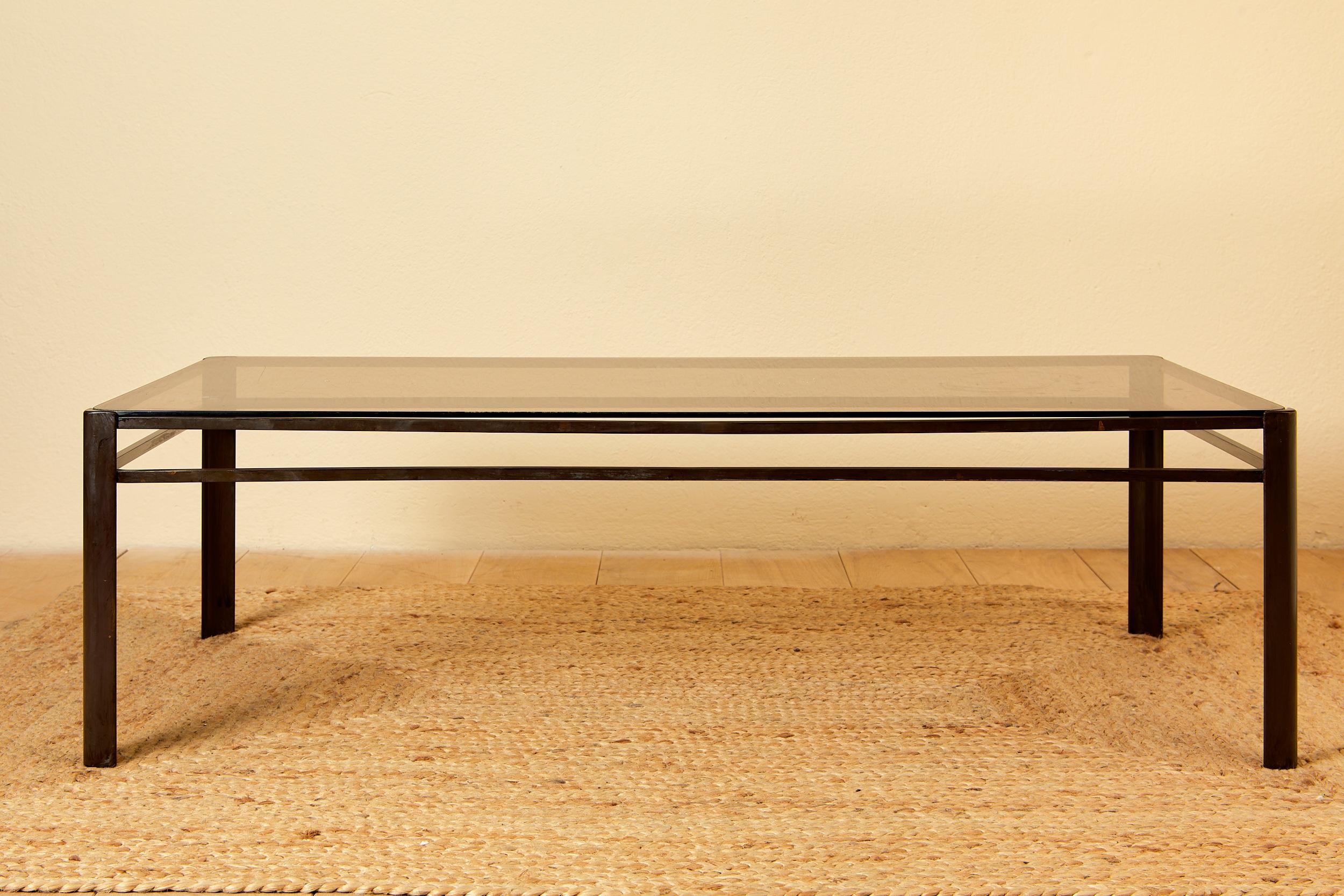 Jacques Quinet for Mallabert, 
coffee table, 
bronze and smoked glass,
circa 1970, France.
Height 35 cm, width 120 cm, depth 61 cm.