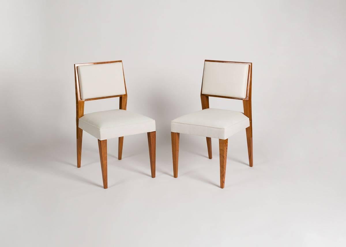 French Jacques Quinet, Set of Eight Blond Mahogany Dining Chairs, France, circa 1950s
