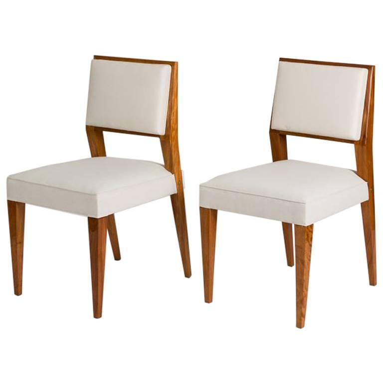 Jacques Quinet, Set of Eight Blond Mahogany Dining Chairs, France, circa 1950s