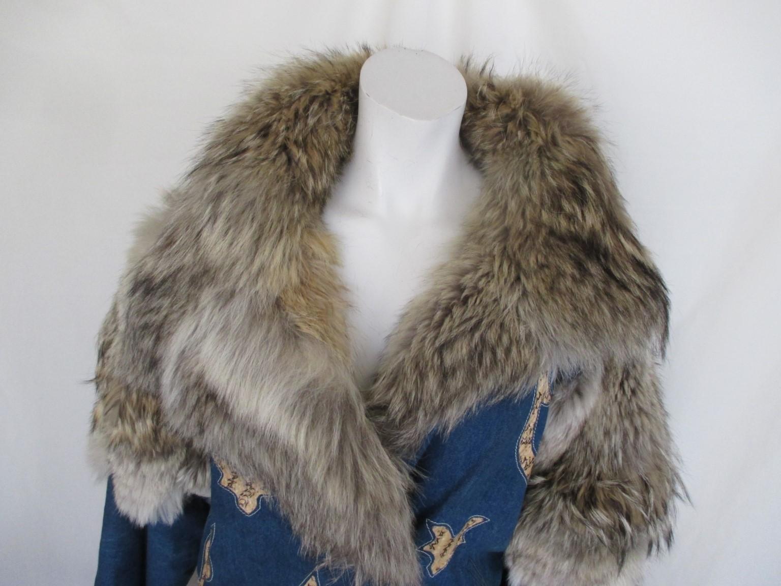 Unique Jacket made from stone washed blue denim, wolf fur and python details.

View our front store, we offer more luxurious vintage items

Details:
With 2 side pockets and 4 press buttons.
Customized by Jacques Saint Laurent, French designer 
Fully