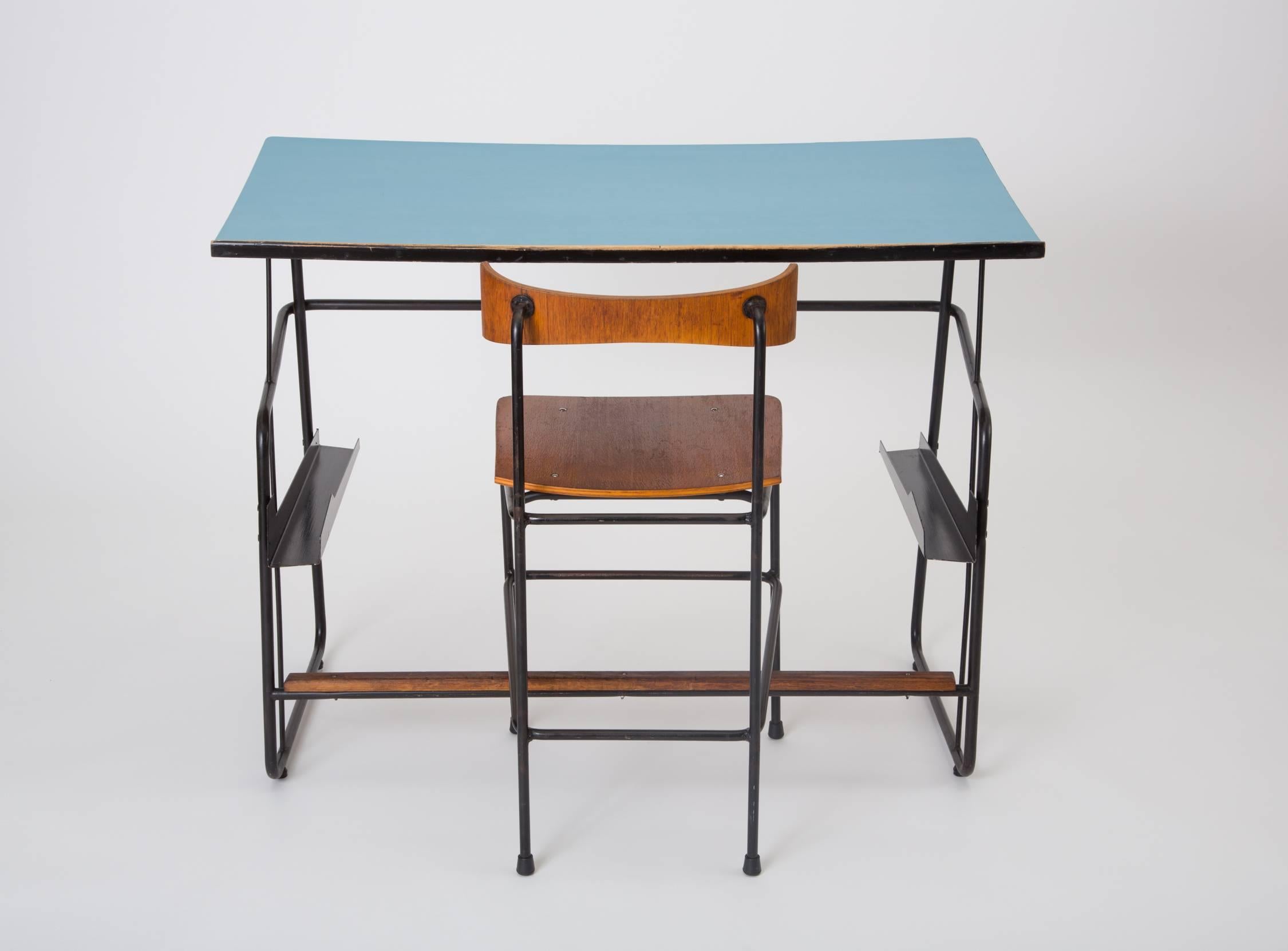 Designed in 1959, this drafting set was originally produced for use in the architecture school at the University of Ghent, and was manufactured in Deinze by Swan. Comprising a tall desk and chair, the set has industrial stylings, with a frame of