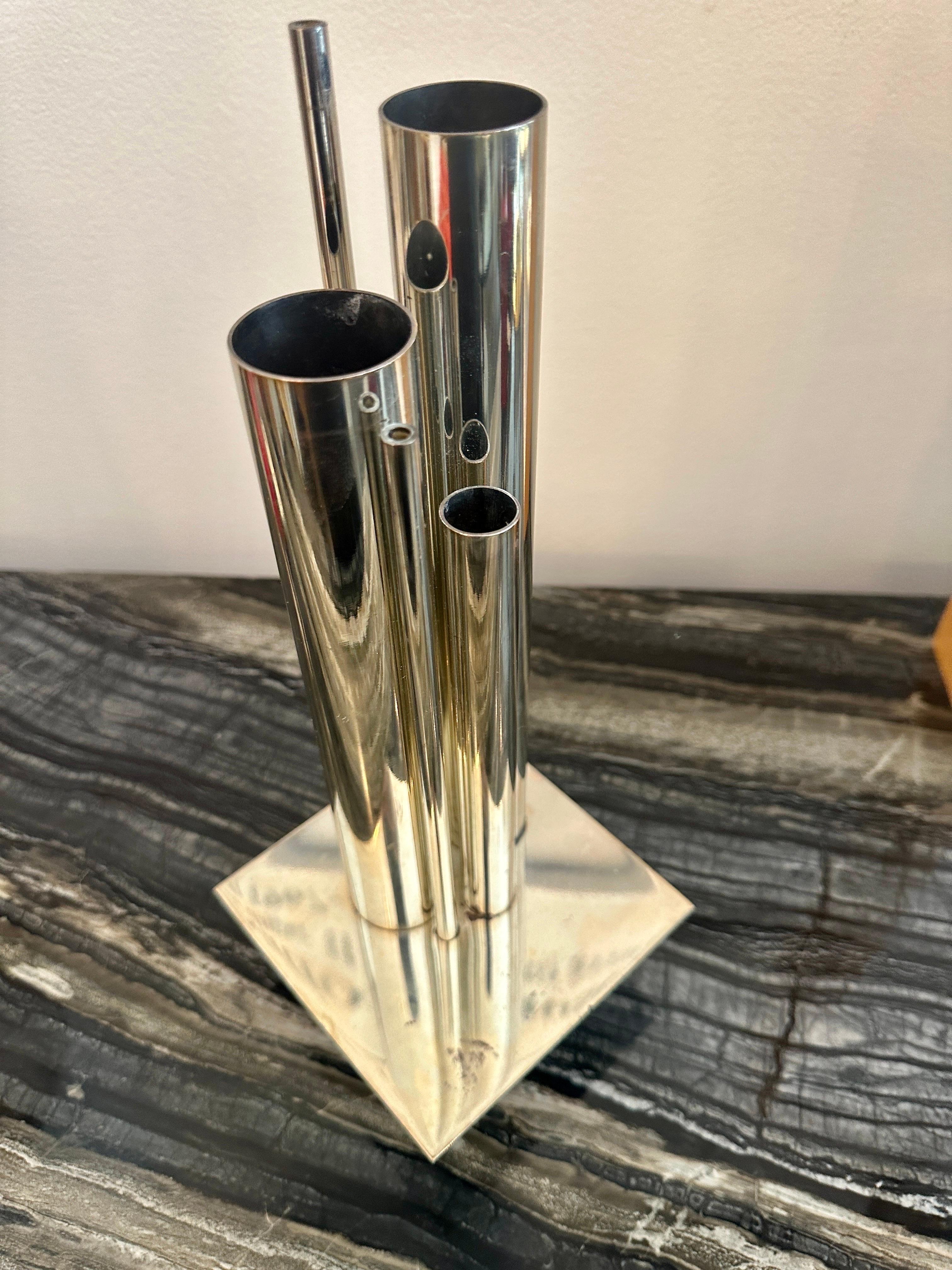 A silver plated architecturally inspired vase with multiple cylindrical tubes.  Signed, Made in France and shows patina throughout.  THIS ITEM IS LOCATED AND WILL SHIP FROM OUR EAST HAMPTON, NY SHOWROOM.