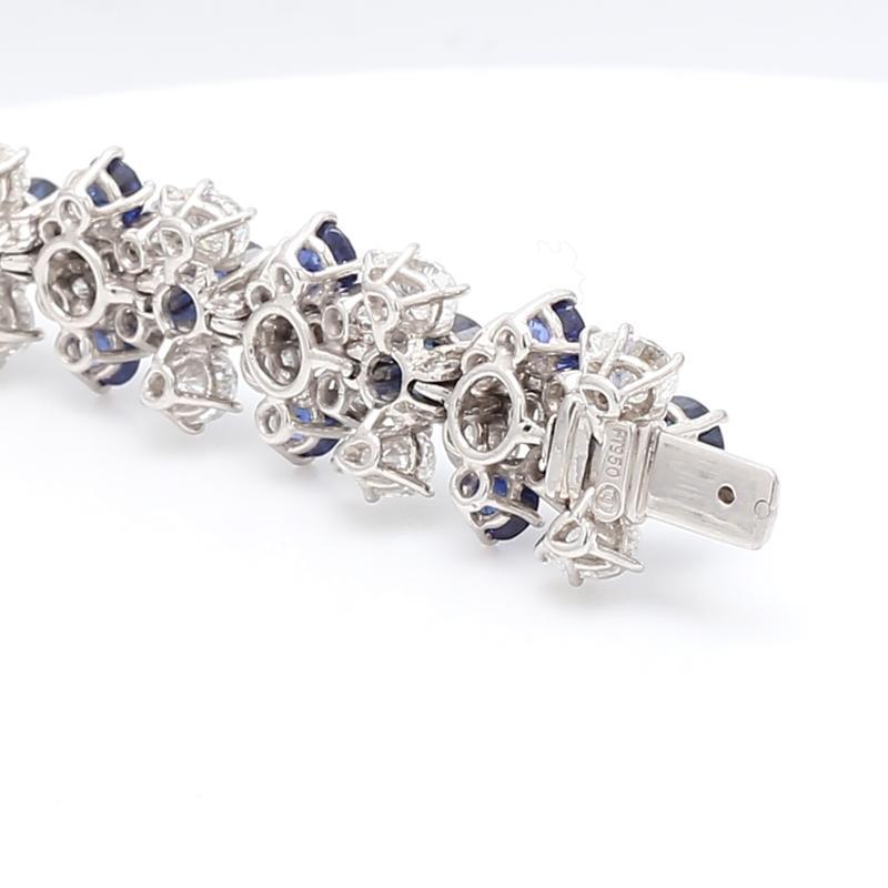 Jaques Timey for Harry Winston, platinum, sapphire, and diamond bracelet. Bracelet is set with thirty-nine (39) round brilliant cut sapphires weighing approximately 12.80ctw, sixty-five (65) round brilliant cut diamonds weighing approximately