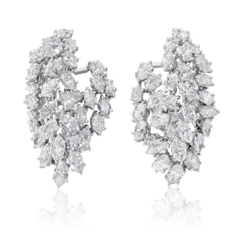 Jacques Timey diamond waterfall earrings in platinum and 18k white gold. Circa 1960’s. The  earrings consist of 68 cascading marquise cut diamonds with total weight of approximately 8.00 carats color F/G, clarity VS. 
Crafted in platinum and 18k