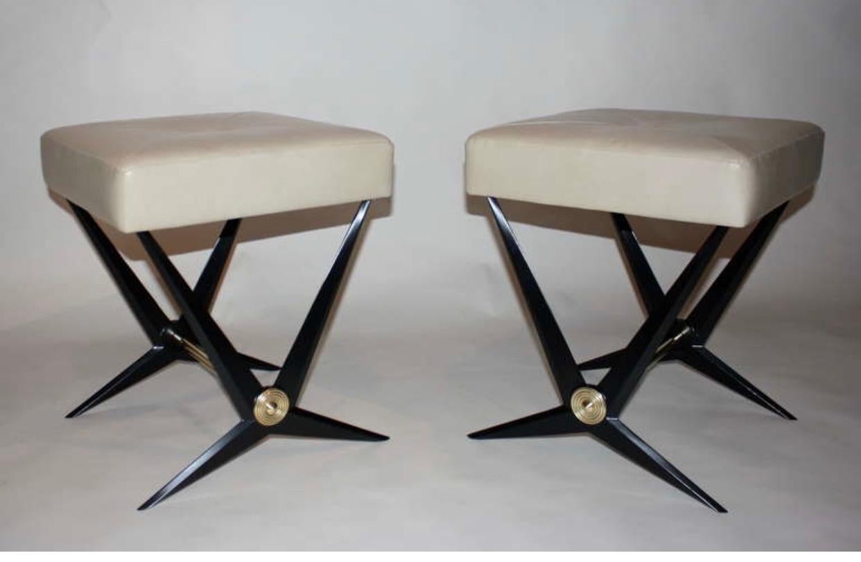 Jacques Tournus benches cast aluminum in black enamel base, iron and brass, with leather seat. Very good to excellent condition.