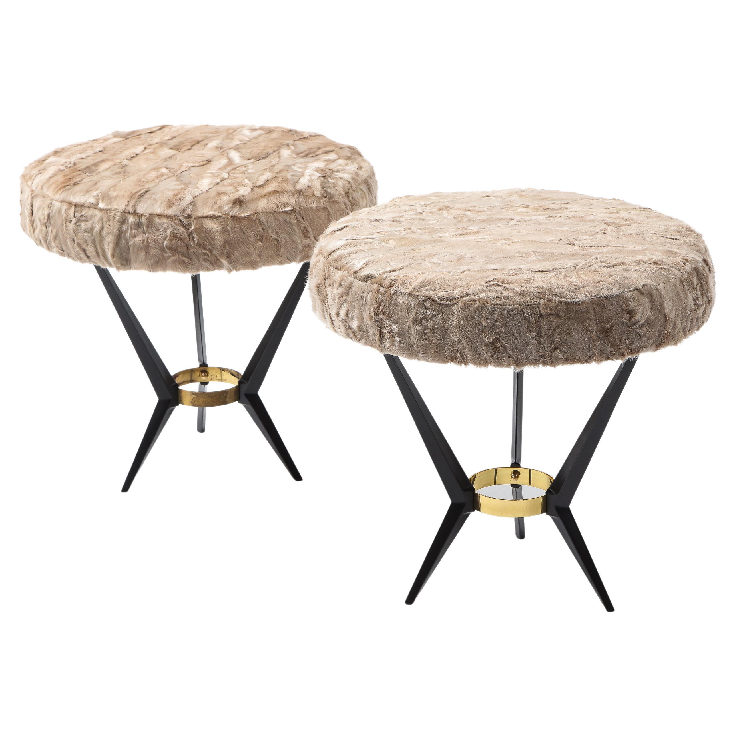 Elegant pair of stools in enameled cast aluminum and brass with upholstered tops.