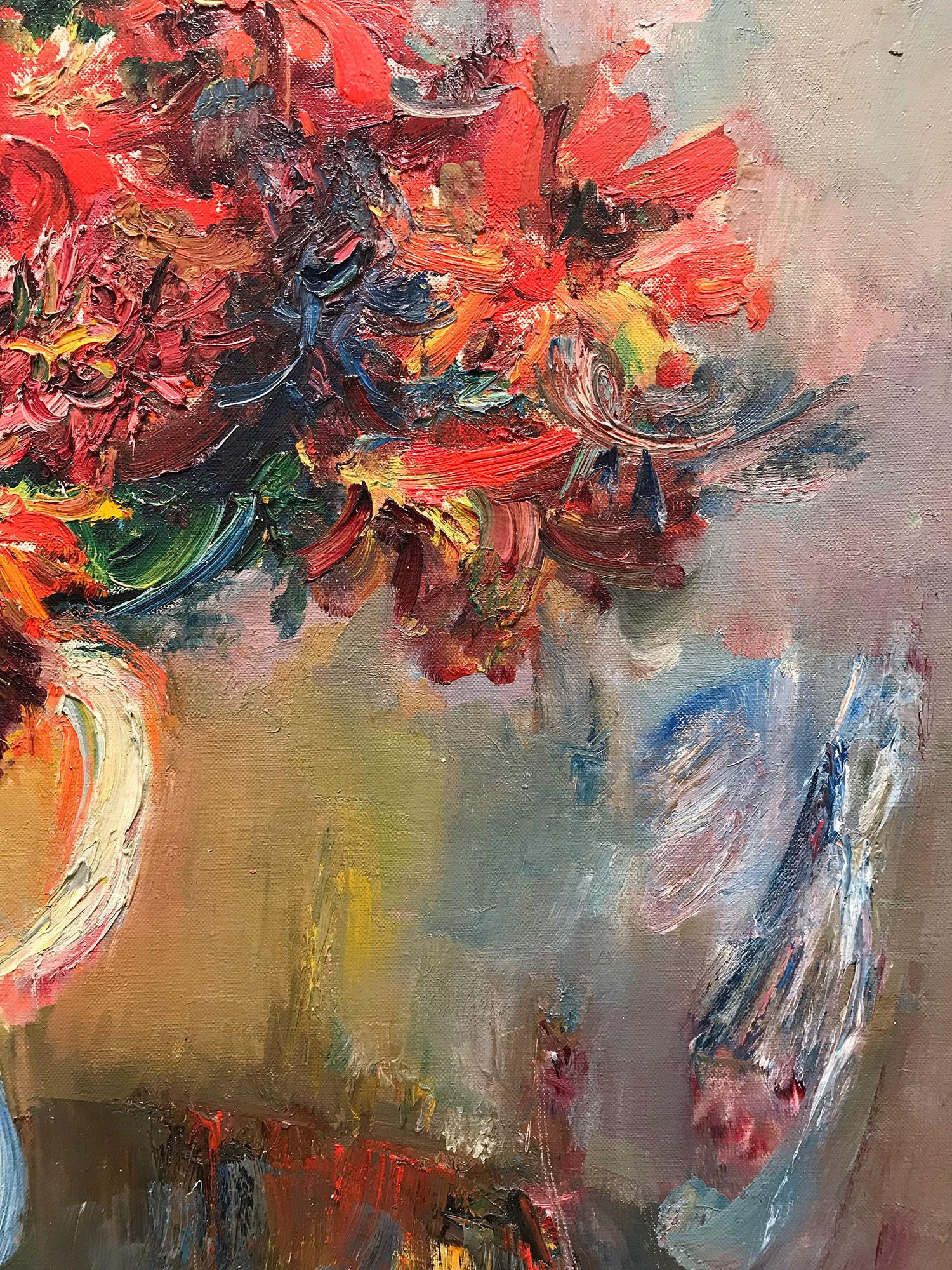 This painting depicts a whimsical bouquet of flowers in a beautiful white jug seated on a table with a background bursting with colors. The piece is done in a highly impressionistic manner with unique colors and expressions. This painting is a