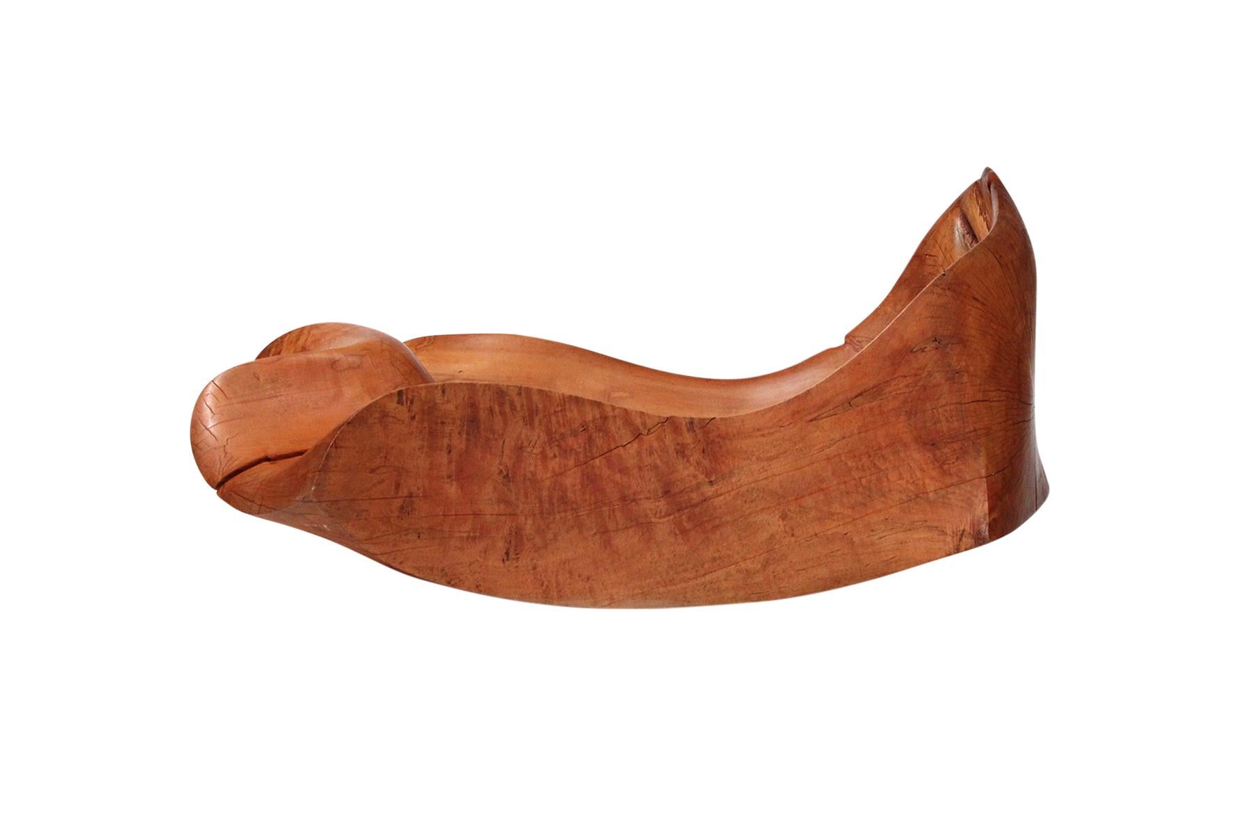 Carved sculptural chaise lounge by Jacquin Smolens. Smolens was a life long friend of Wharton Esherick, who inspired Smolens to sculpt and create furniture. He maintained a studio in Rock Hall Maryland starting in 1970. This piece was acquired