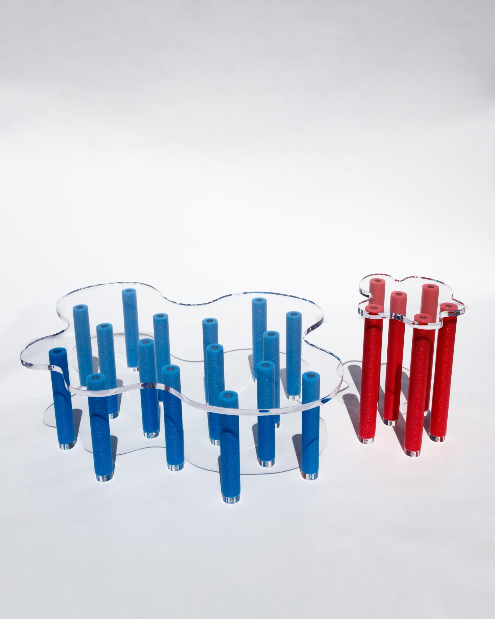 Inspired by the endless summer, pool party culture that is often associated with Los Angeles, the pool table and Jacuzzi table are a playful experiment in form and materiality. The wavy acrylic table tops take on the form of irregular shaped pools