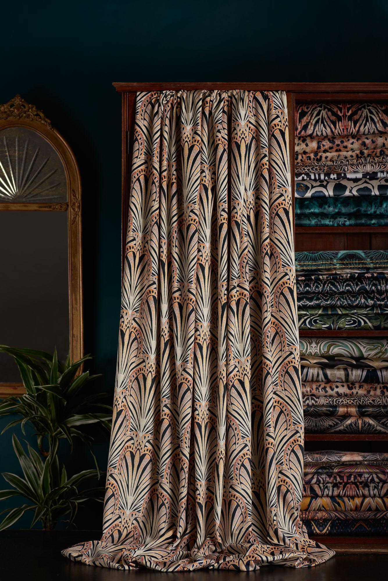 Jada is a 1920s inspired print. This fan-like lino printed design in gold black and peach tones evokes a timeless ambience.

This velvet has a very different handle from our standard velvet. It is extremely floppy and very soft, which makes it ideal