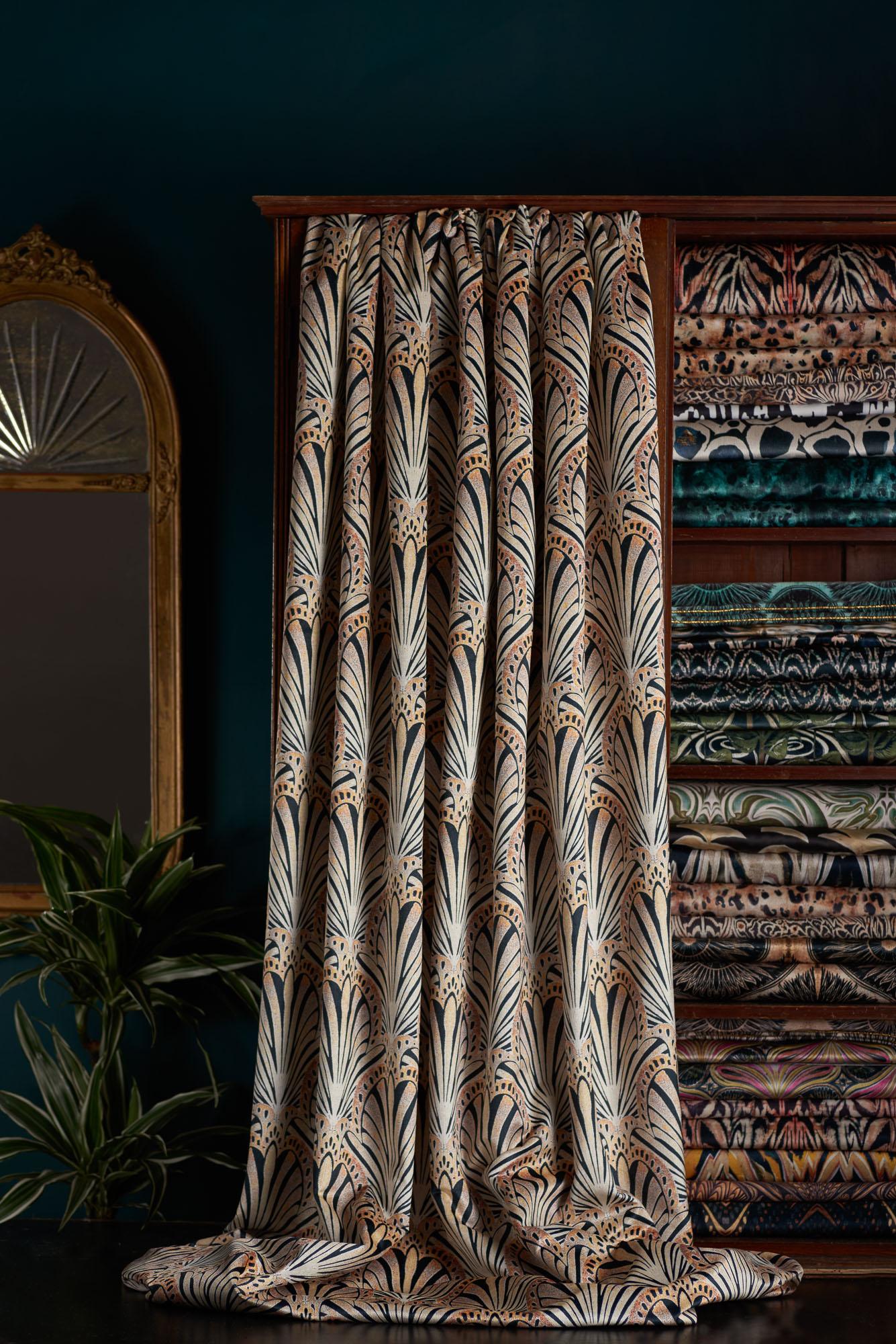 Jada is a 1920s inspired print. This fan-like lino printed design in gold black and peach tones evokes a timeless ambience.

This velvet is midweight, with a strong straight woven backing, so is suitable for upholstery, but is also light enough for