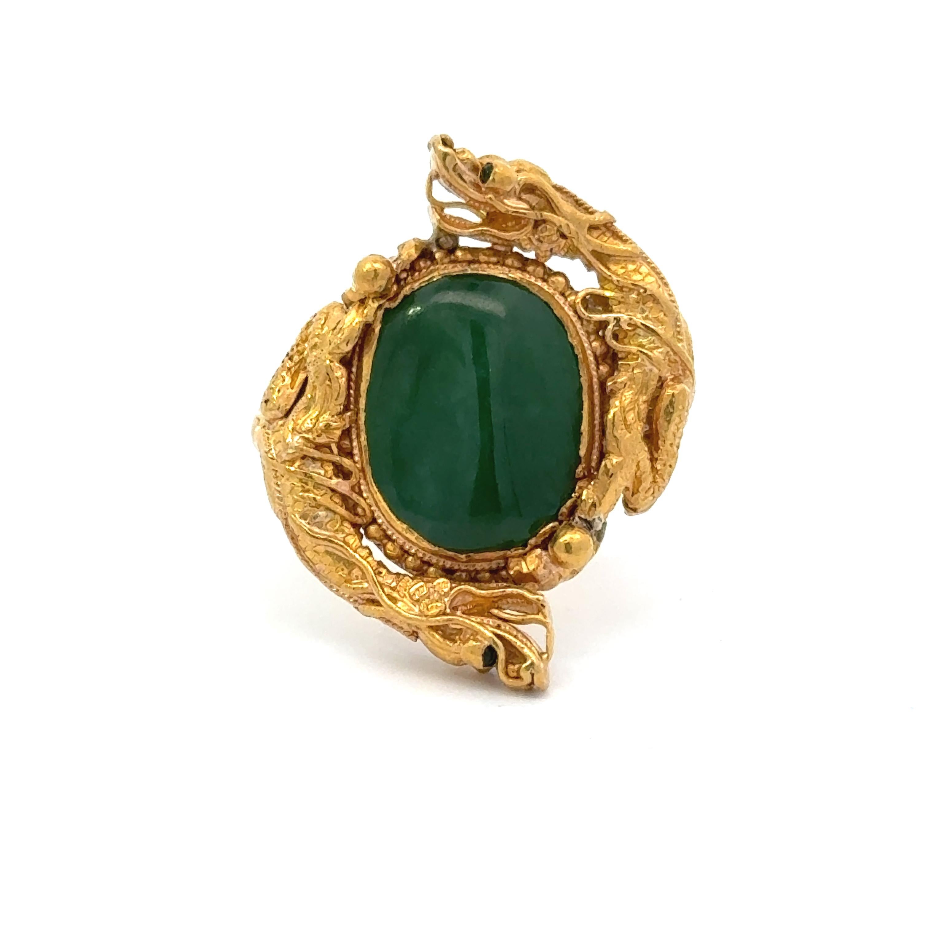 This exquisite Jade and 14K Yellow Gold Vintage Dragon Ring is truly one of a kind. Crafted with high-quality materials, it exudes a luxurious and unique appeal. Boasting intricate dragon detailing, it is a perfect addition to any jewelry