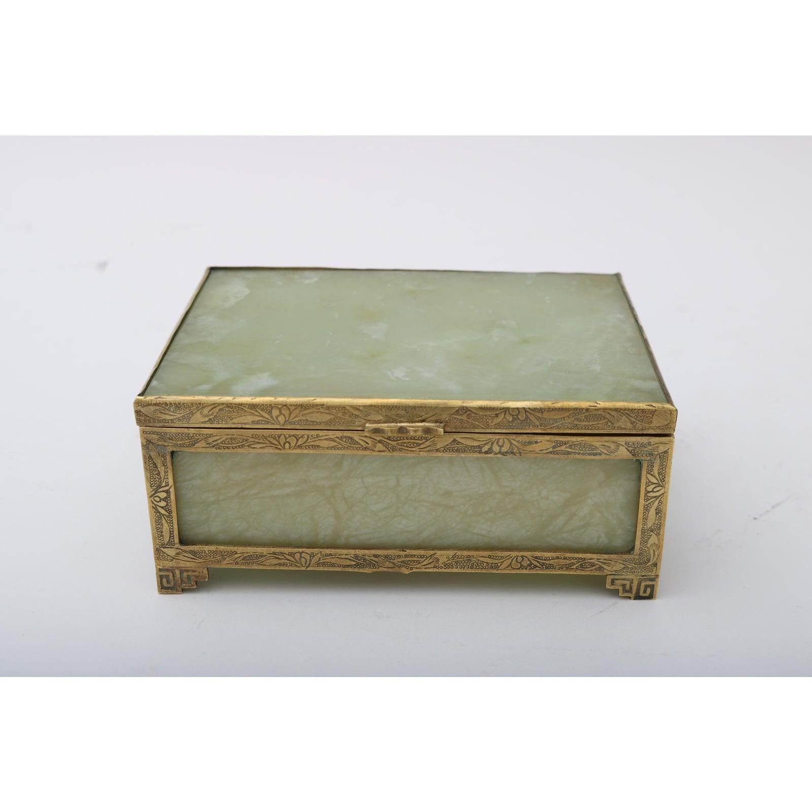 This stylish two-piece Art Deco Chinese brass and green jade storage box and match box holder date to the 1920s-1930s.

Note: Match box holder dimensions are 1