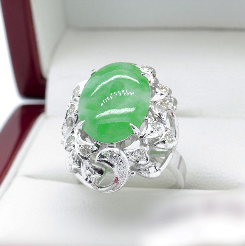 Recent Jade and Diamond Cocktail ring in White Gold.
A lovely, like new, Jade and Diamond Cocktail ring that sits 1960's style proudly on the hand.  It's a showstopper worthy of any Red Carpet event.  
A White Gold Dress Ring with a narrow, flat