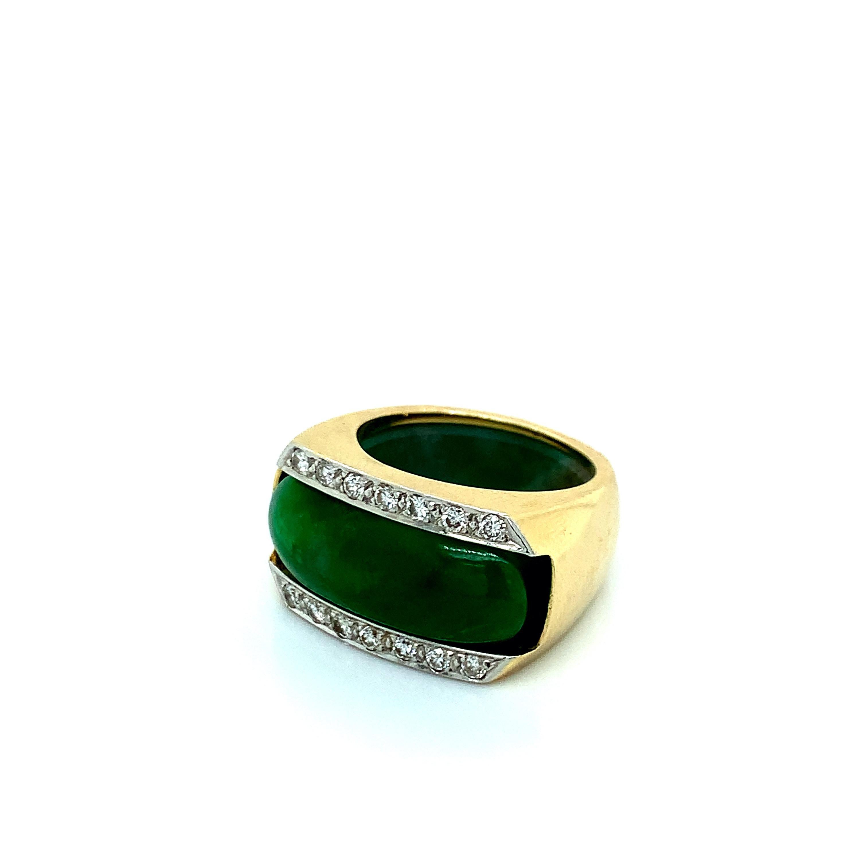 A 14 karat gold insert ring with a natural type A jade ring that fits perfectly inside. Total weight: 15.3 grams. Size 6.5. 