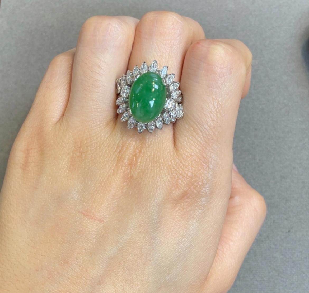 Jade and Diamond Ring 

A cabochon jade ring accented by round, baguette, and marquise cut diamonds

Approximate Diamond Weight: 3.91
Ring Size: 6.75
Complimentary resizing 
Metal Type: Platinum