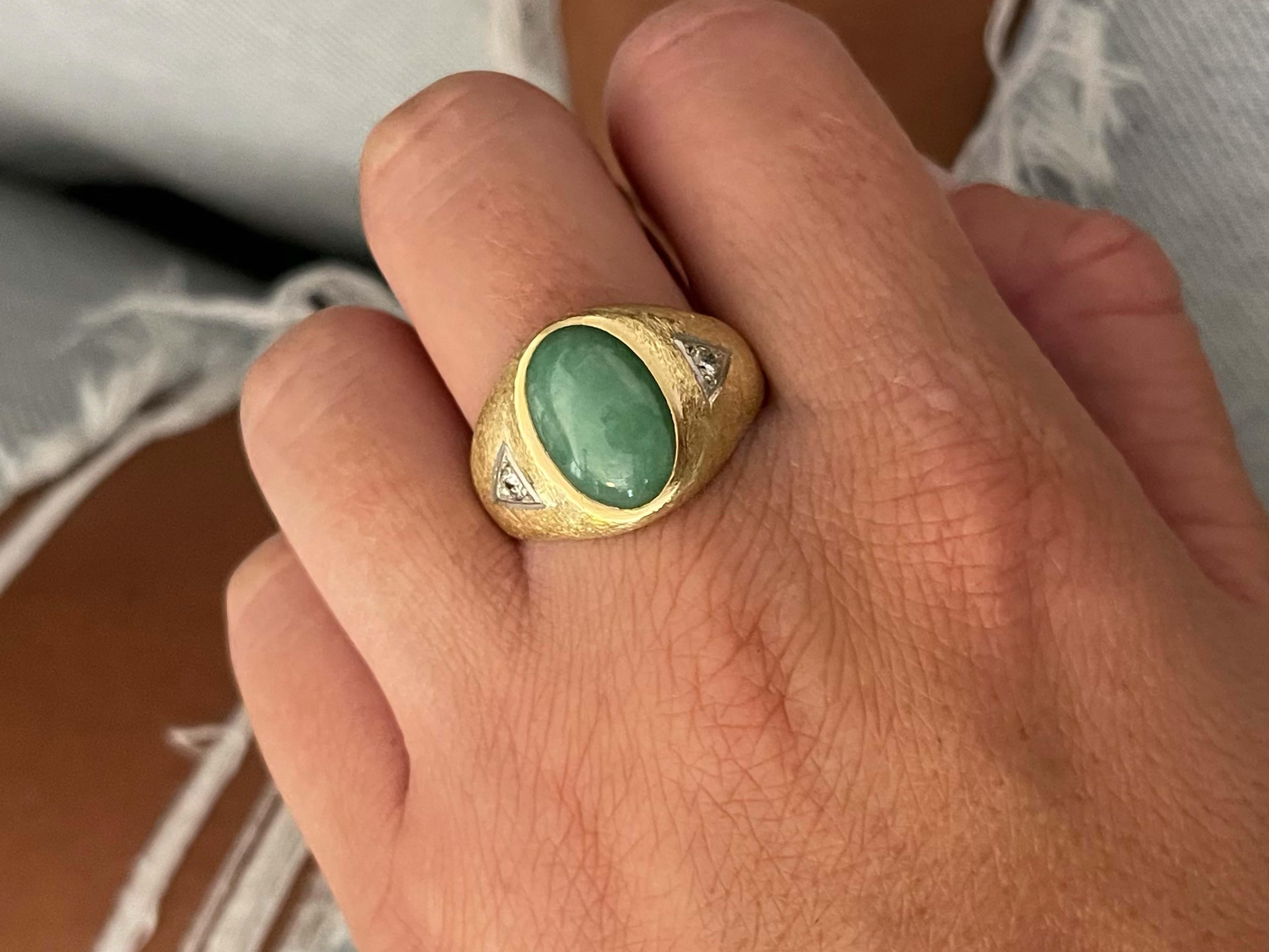 Item Specifications:

Metal: 14k Yellow Gold 

Style: Statement Ring

Ring Size: 12 (resizing available for a fee)

Total Weight: 10 Grams

Gemstone Specifications:

Center Gemstone: Jadeite Jade

Shape: Oval

Color: Green

Cut: Cabochon 

Jade