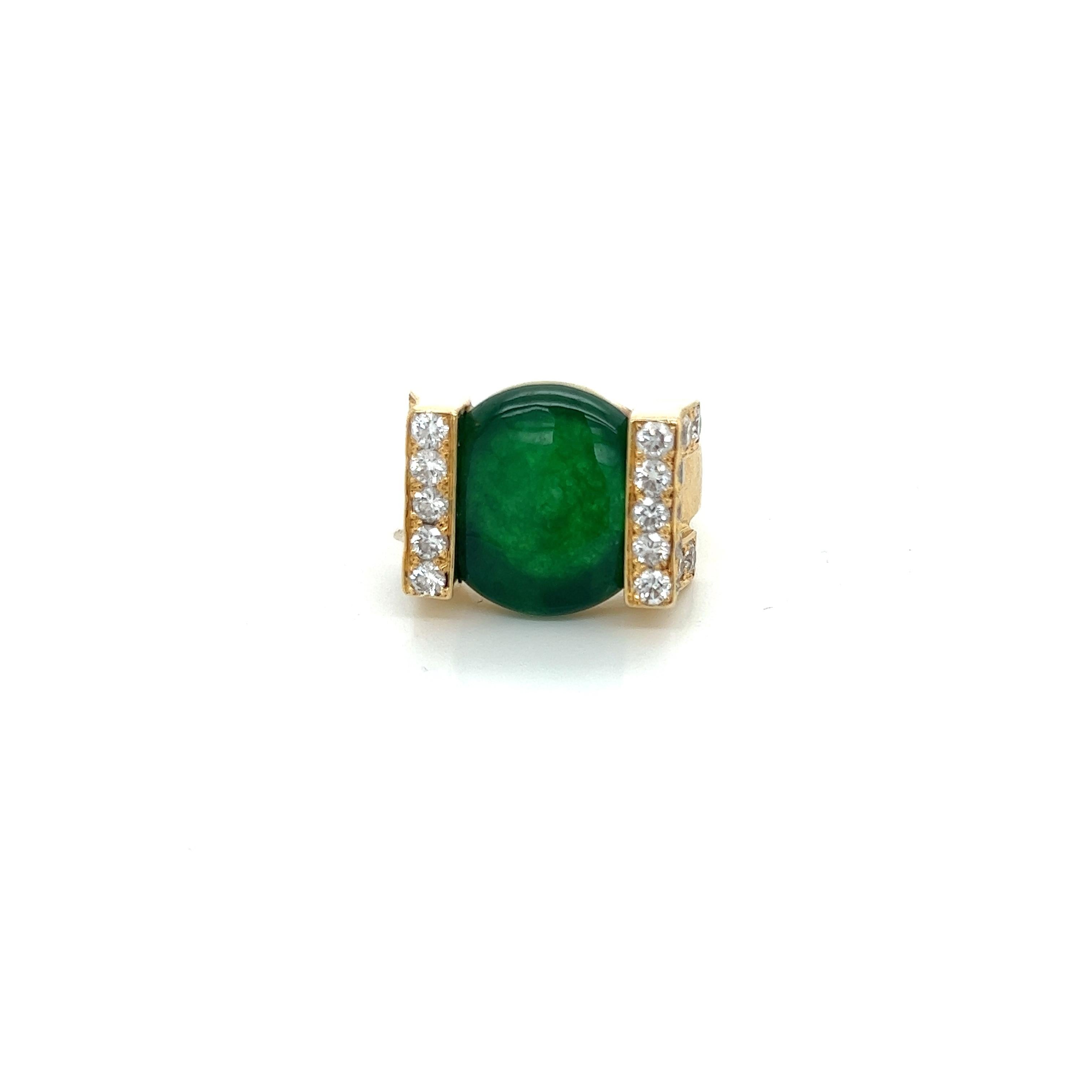 18k yellow gold cocktail ring with rich green jade and approximately 1.4tct white diamonds.
Size 5.75.
