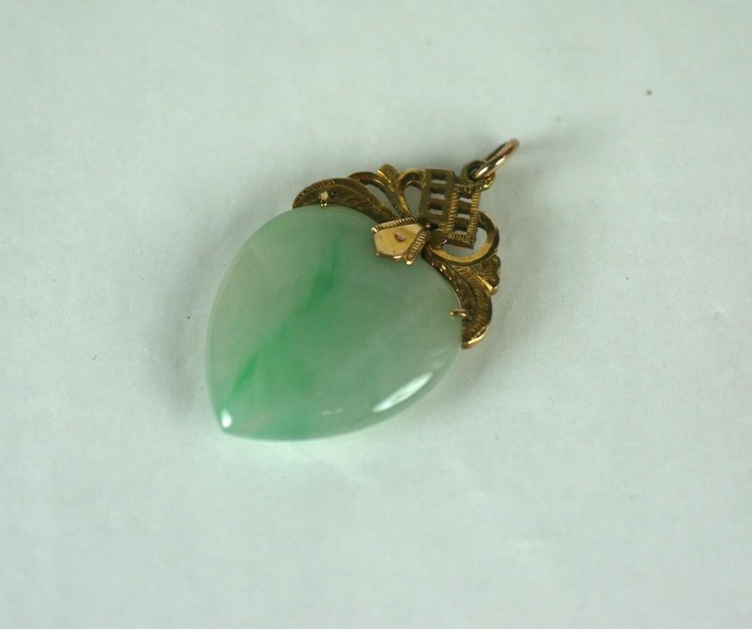 Jade and 22k Gold Pendant, mid 20th Century Chinese. Undyed jade with elaborately chased and etched cap.
1.5