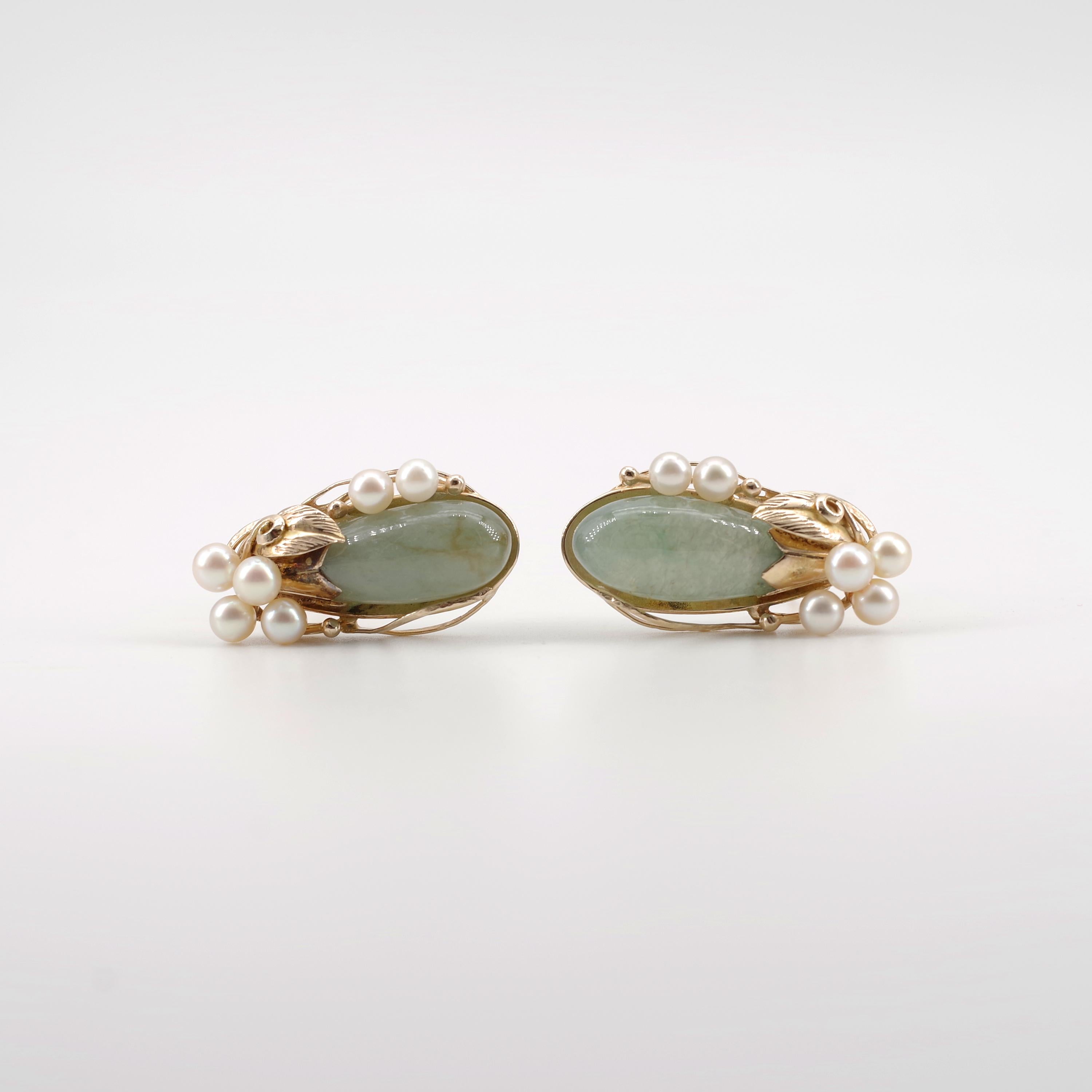 These 14k yellow gold clip-on earrings were created in the 1960s by Ming's, a jewelry store that opened on Hawaii in the 1940s and became iconic, beloved for their fine jade, pearl and coral jewelry. Ming's jade pieces are instantly recognizable