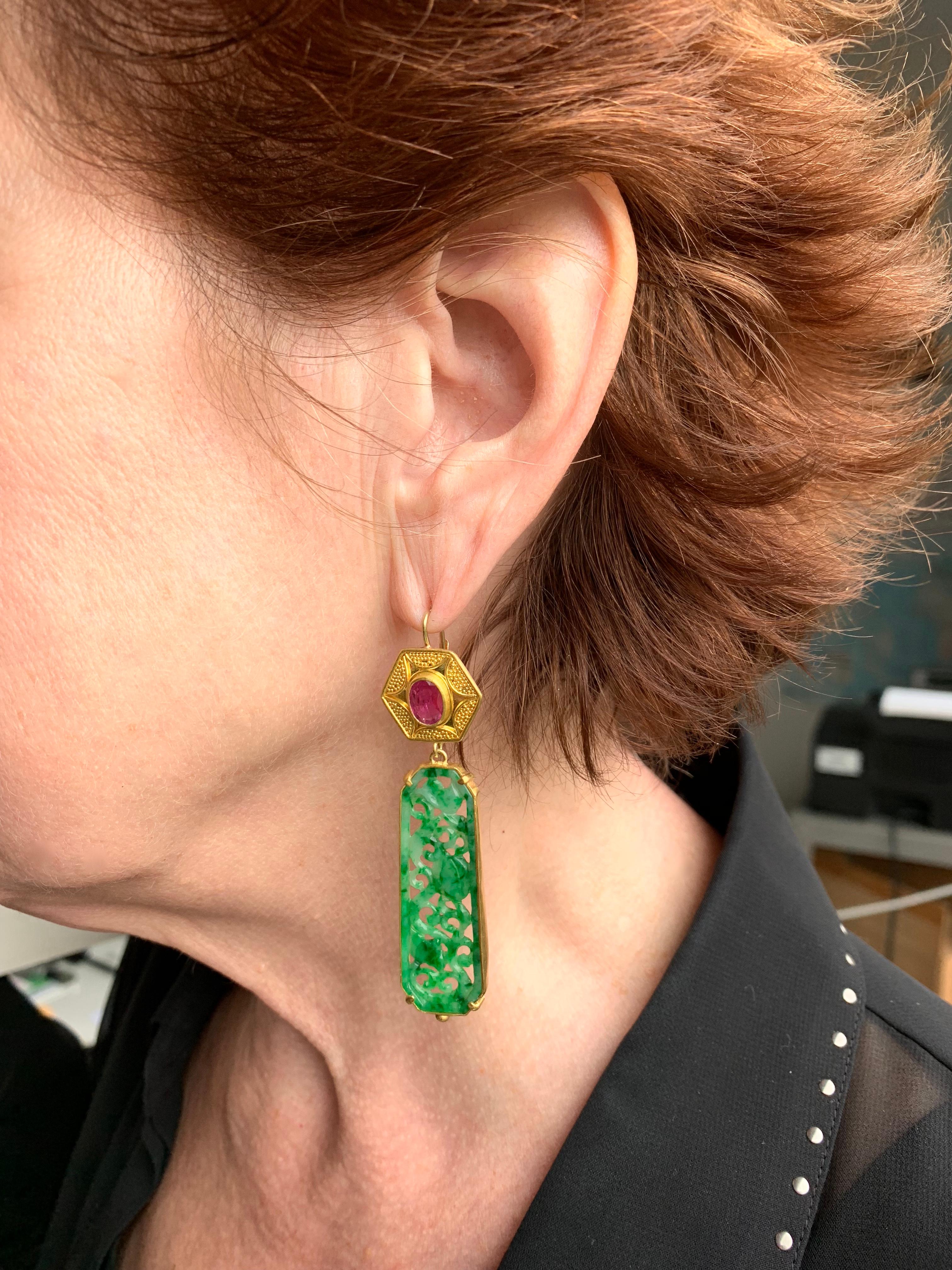 22 Karat hold Ruby earrings with carved Jade dangles, Rubies are set within a granulation motif, and  French lever backs . Elegant and refined, perfect for any season, green jade is believed to bring serenity, tranquility,  and good luck in