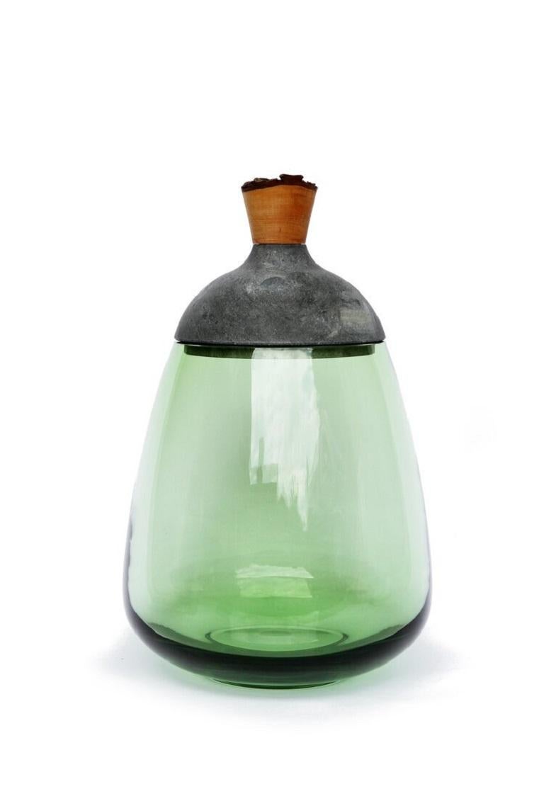 Jade and Soapstone Terra stacking vessel, Pia Wüstenberg
Dimensions: D 23 x H 37
Materials: glass, wood, soapstone
Available in other colors, marble version and onyx version.

Dense in its tones and materials, and in the same time refined in