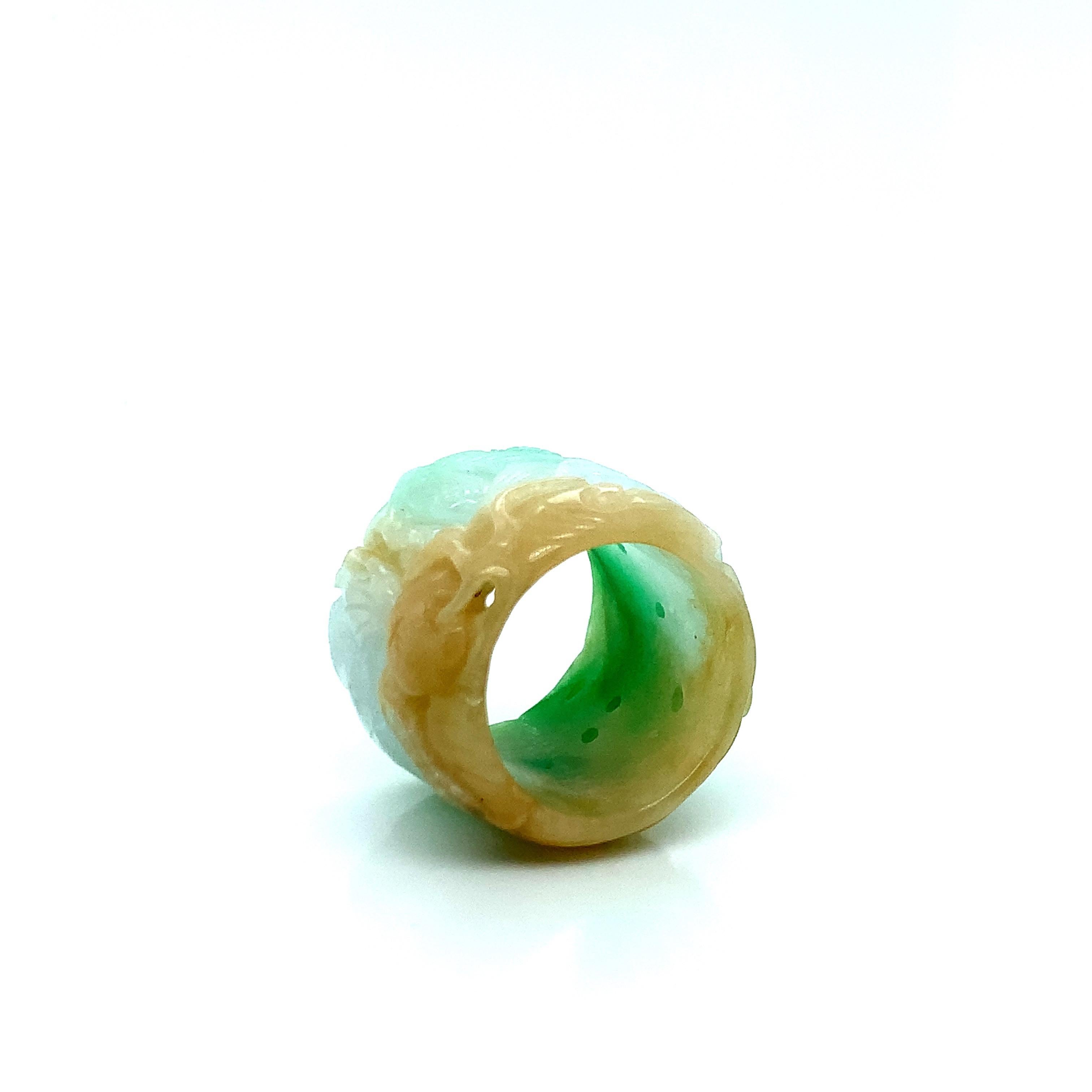 A wide carved jade tri-color archer's ring with a Mason Kay report dated July 27, 2022, stating natural jadeite jade - no indications of dye or impregnation detected. Natural type A jadeite jade. Total weight: 15.0 grams. Size 9.5.