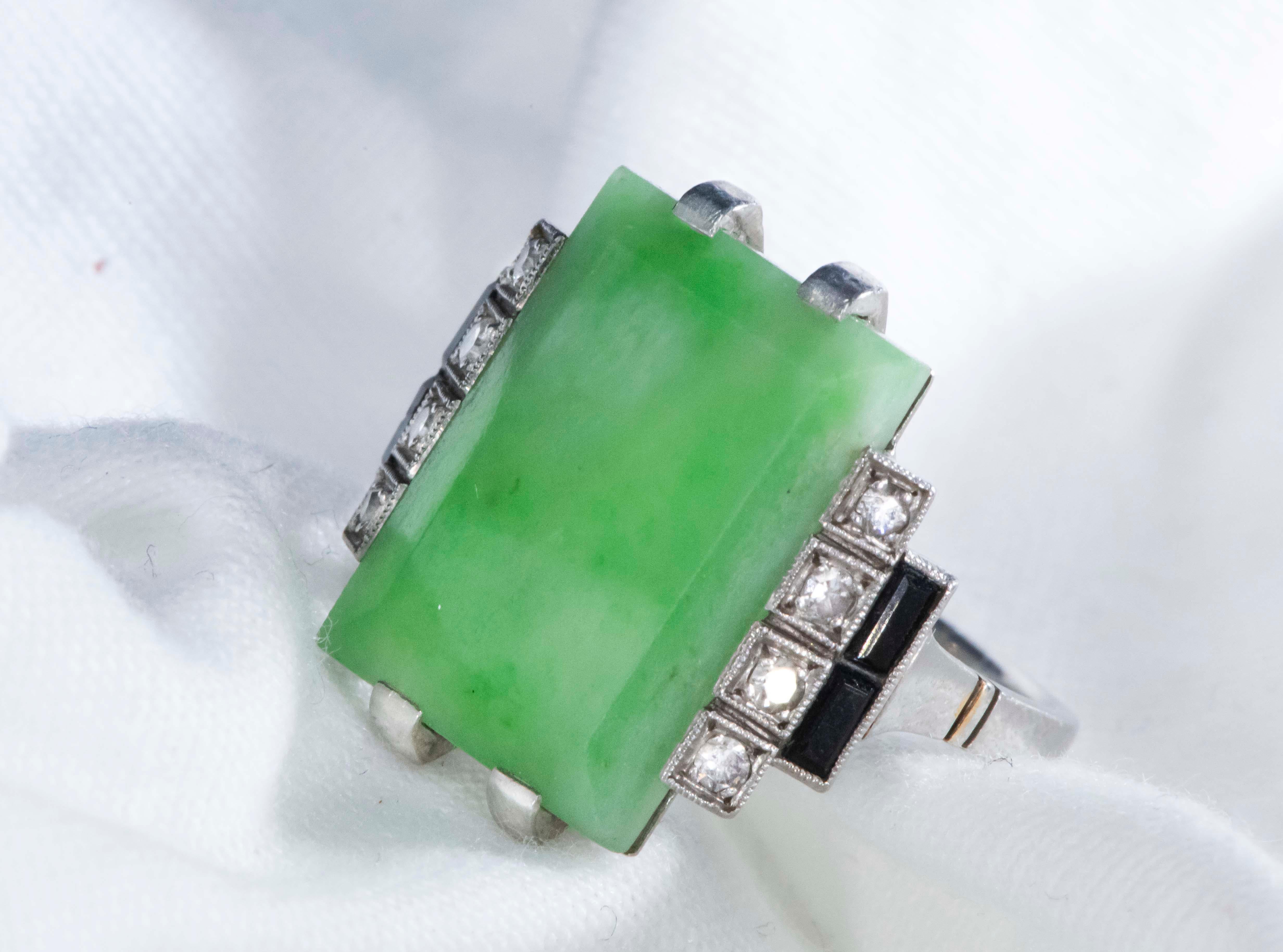 Specifications & Dimensions
The present ring is a very impressive and sophisticated large 1920s French Hallmarked Art Deco Platinum Diamond Set  Onyx Green Jade ring. 
The jade center stone shows excellent color throughout and the center stone