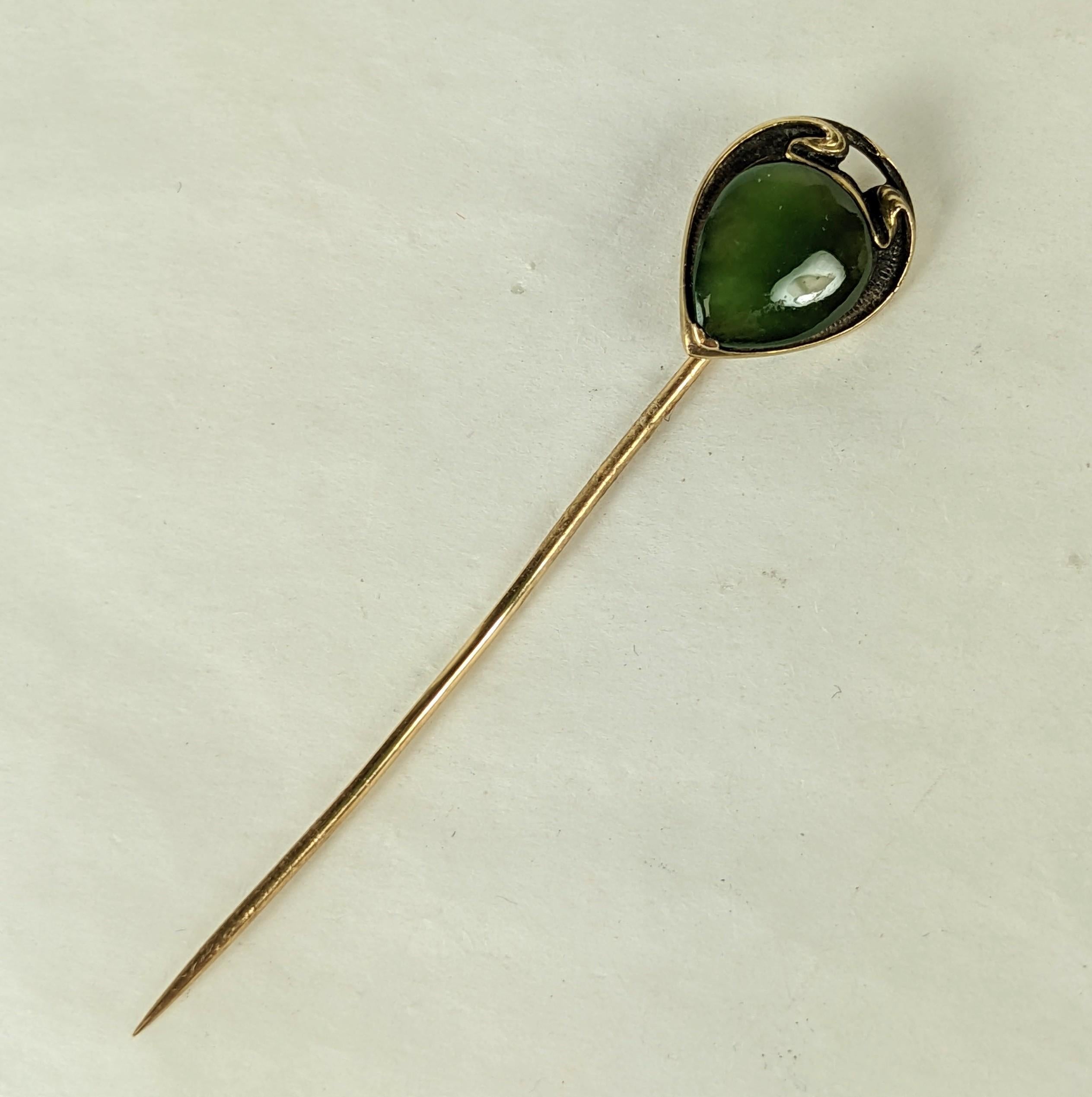 Lovely Jade Art Nouveau Stick Pin circa 1900 USA. Made in the jewelry hub of Newark NY with 14K gold hallmarks in patinaed gold whiplash setting. 
.5