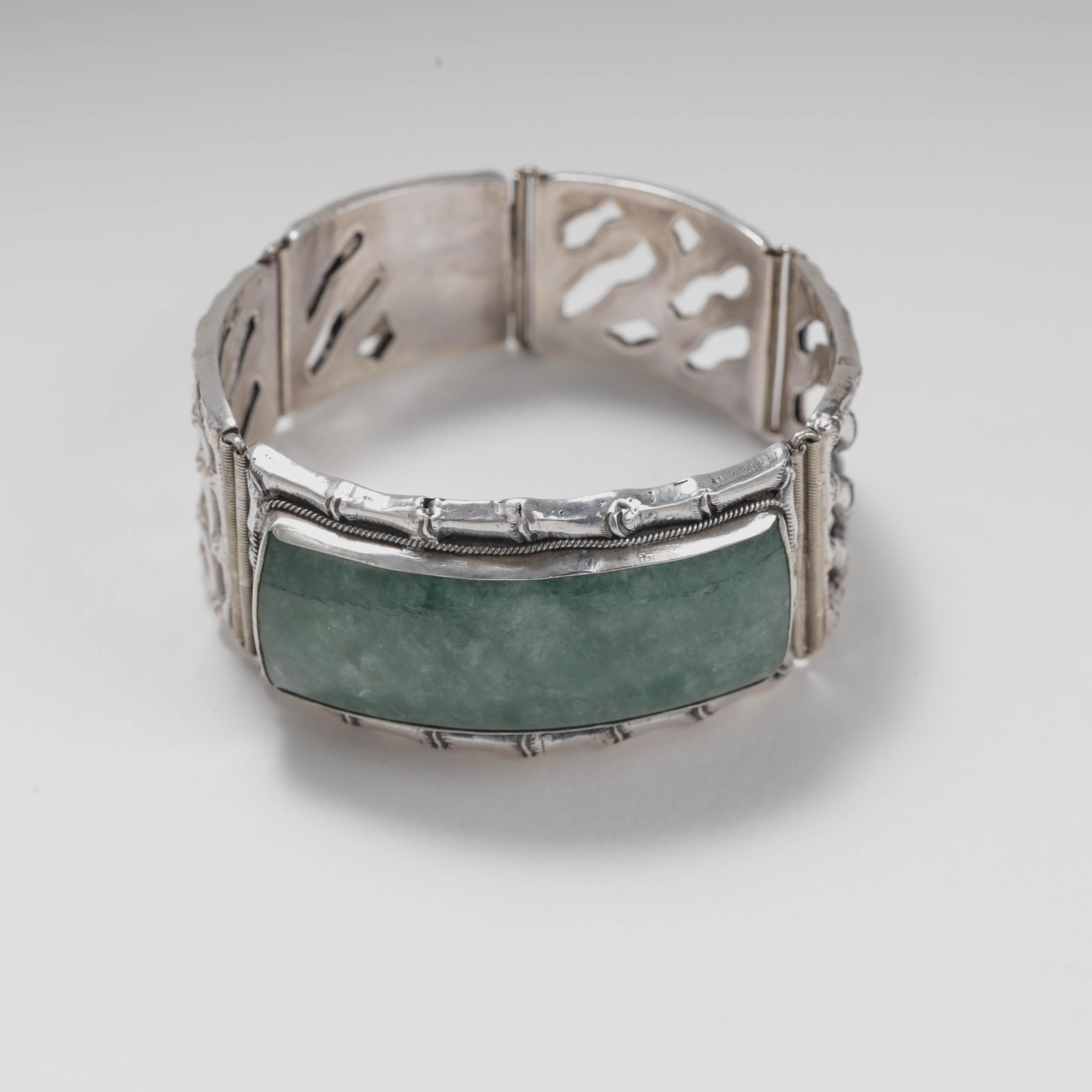 This is such a terrific unisex handmade bracelet: weighty, substantial, and very well-made in China in the 1960s. Crafted entirely in sterling silver, the bracelet is composed of 5 silver panels, each created in a bamboo motif. The central panel