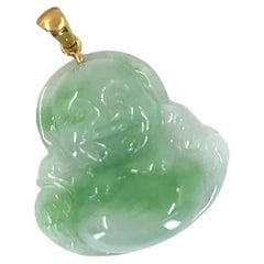 Jade buddha pendant in 18 karat yellow gold
