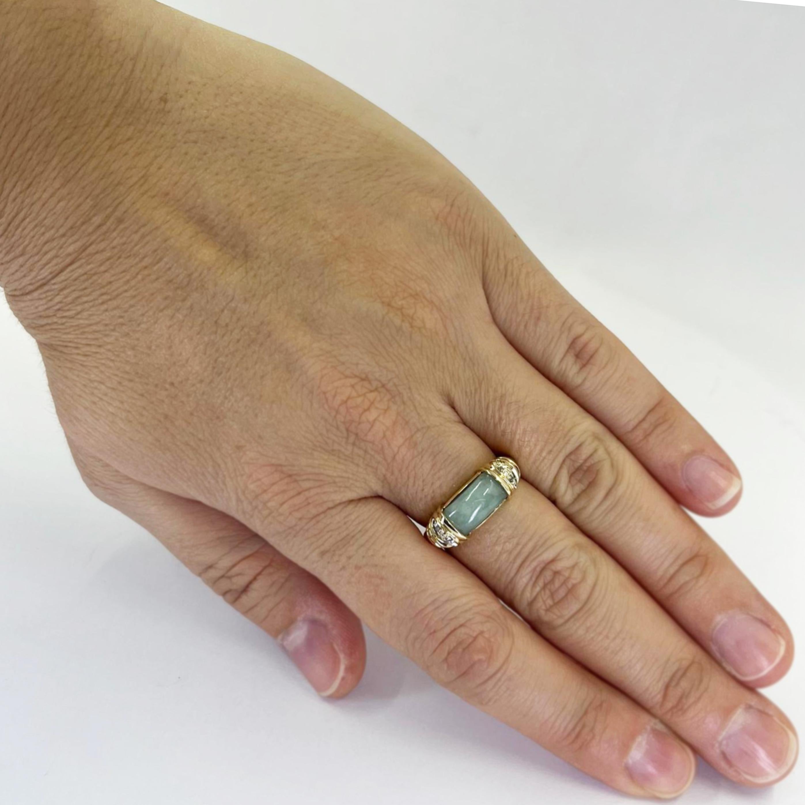 14 Karat Yellow Gold Ring Featuring A Cabochon Jade Inlay Accented by 4 Single Cut Diamonds of SI Clarity and H Color. Finger Size 7.25. Finished Weight is 4.5 Grams.
