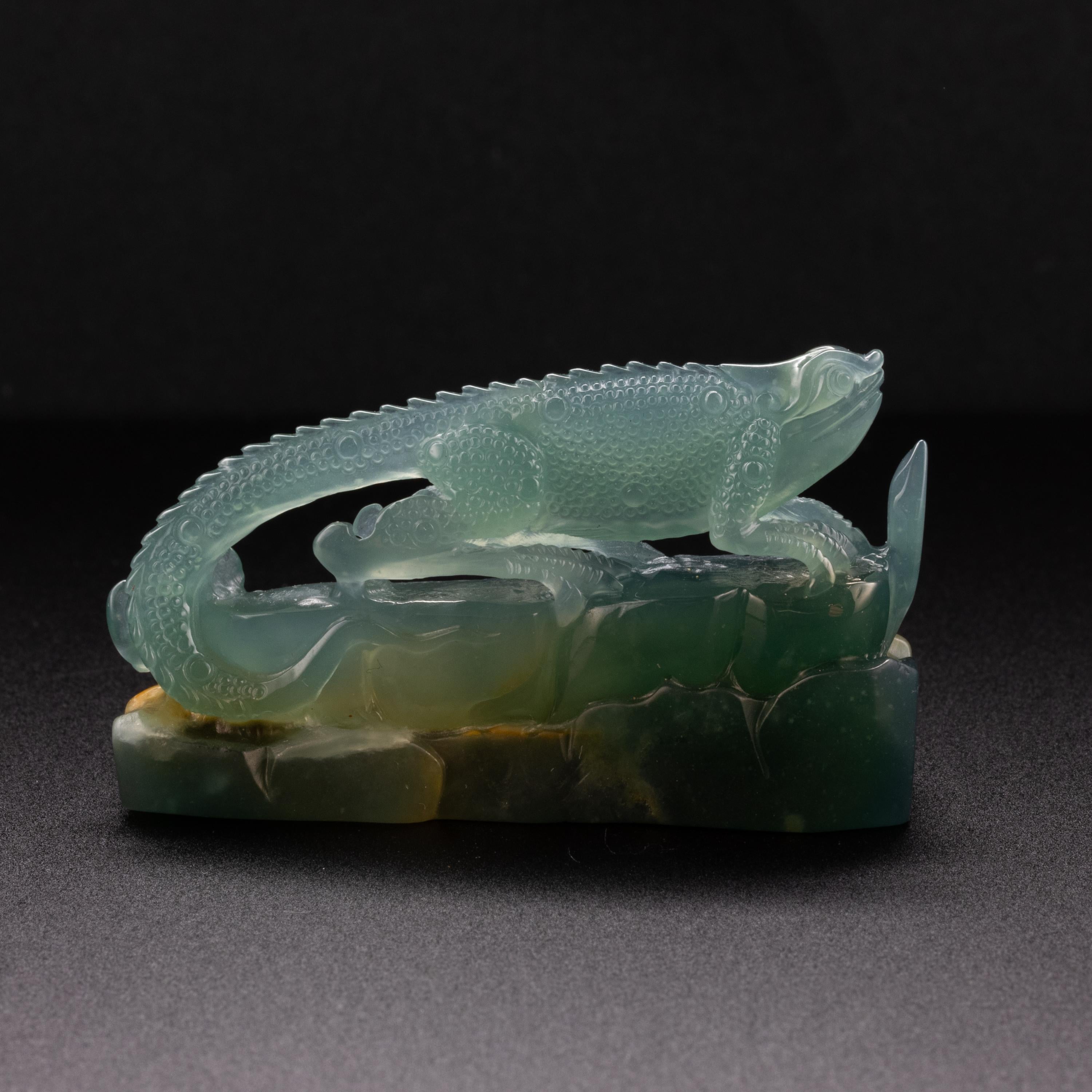 Winter will be here soon. Do you need a companion on your desk or beside your bed? This artfully and skillfully carved iguana may be the friend you need. 

Most fine jadeite comes from Burma (Myanmar) but Guatemala is another of very few sources of