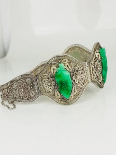 Jade Carvings Set in Wide Silver Hand-Carved Bracelet, circa 1920, China