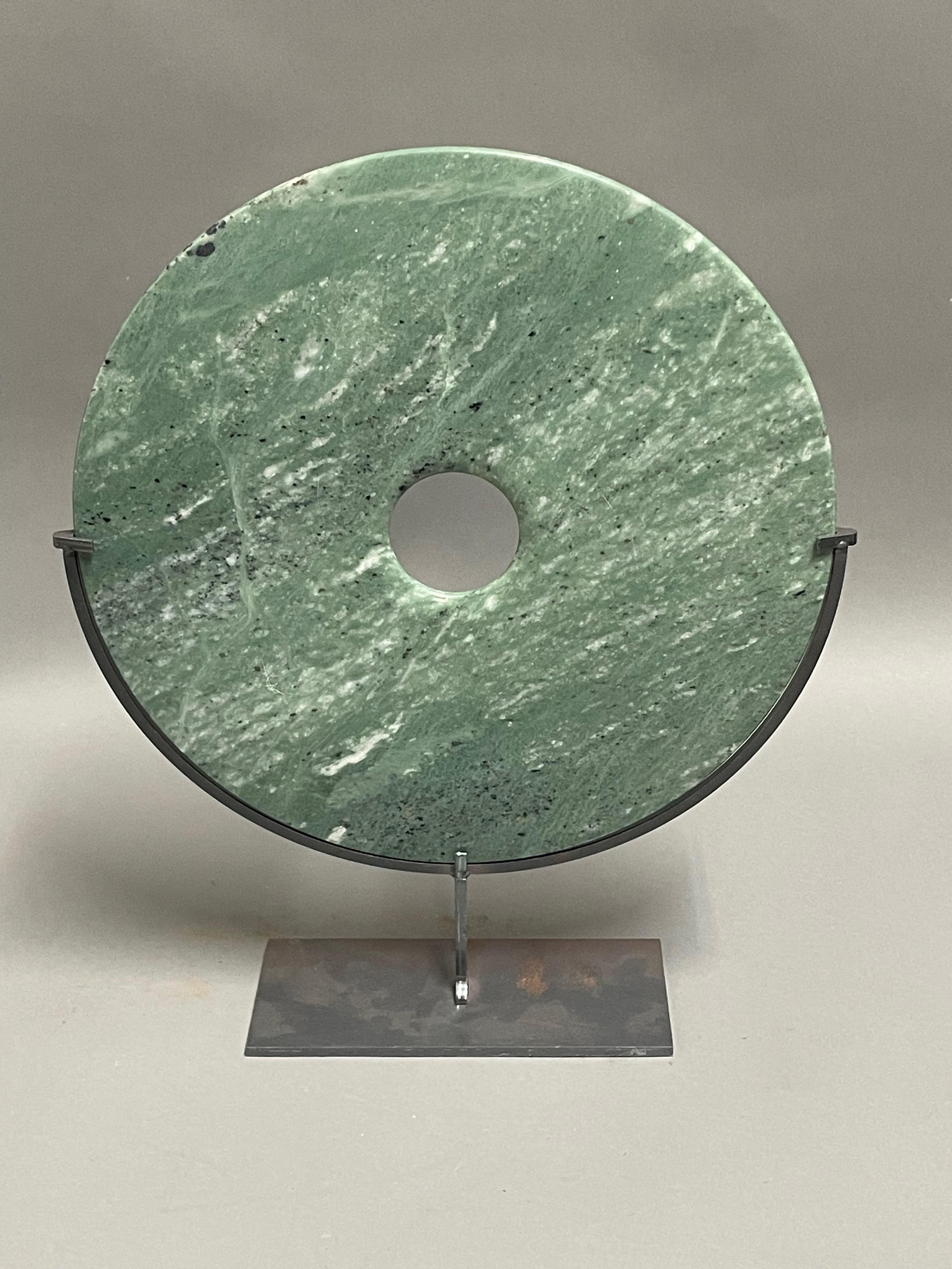 Contemporary Chinese set of two jade colored jade discs.
One disc measures  12d  x  15h    stand measures  7  x   3
One disc measures    8d   x  11h    stand measures  5  x  2.5
Sits nicely with hand carved stone shrimp  S6777
Sits nicely with hand
