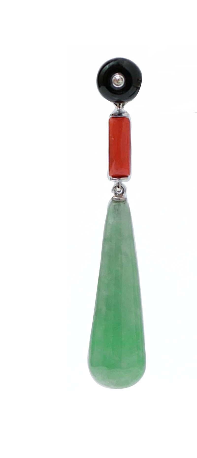 Gorgeous dangle earrings in platinum mounted with a round onyx and a diamond in the upper part, a coral in the middle and, as pendant, a drop jade.
Diamonds 0.03 ct
Onyx and Jade 5.30 gr
Coral 0.10 gr
Total Weight 7.60 gr
RF ++GUCA

For any