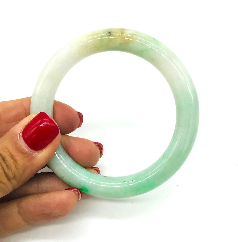 Jade, Dark Green Veined Bangle 10mm Bracelet
Estate owned since 1960's. Rich color veined jade measures: outside diameter 3.13 inches and inside 2.31 inches across
GIA Gemologist inspected and evaluated
