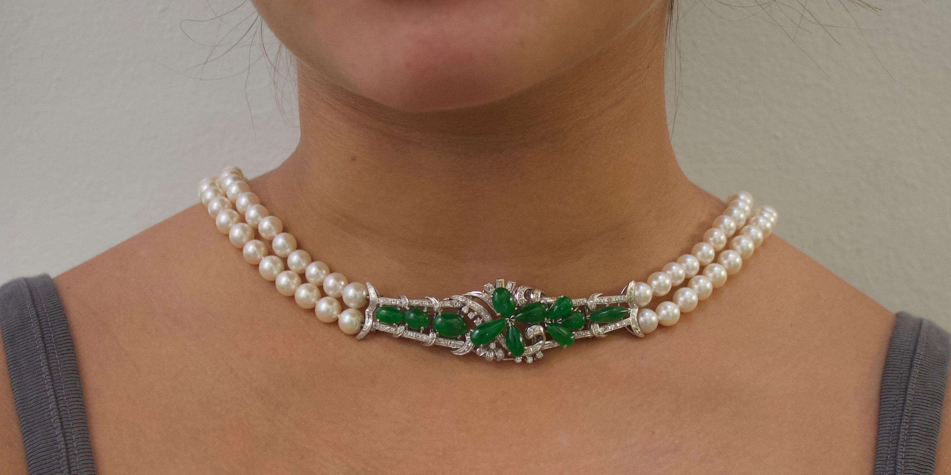 Jade Diamond and Pearl Strand Necklace Circa 1950's 
We Tried To Count The Ways This Can be Worn and Lost Count!
11 Fancy Shaped Cabochon Jadeites 
70 Round Brilliant Cut Diamonds Weighing .70 Carats Approximately 
123 Round Cultured Pearls. 7 - 7.5