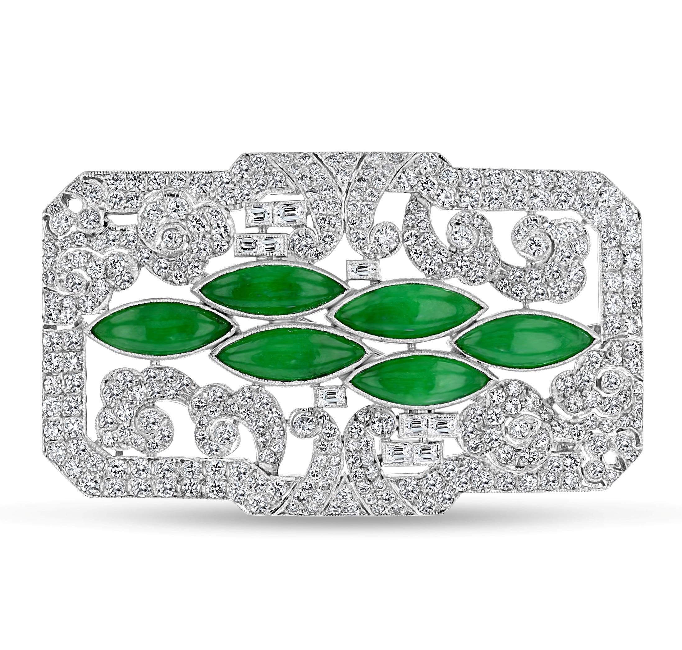 Item #9931

Mason Kay Certified
14K Ladies Brooch and Earring Set with Jade and Diamonds

Brooch
5.15 x 13.10 x 2.43mm random green jade marquise in 6-stone white metal pendant brooch (18.28 grams) 
Earrings
4.75 x 13.15 x 2.65mm green jade marquise
