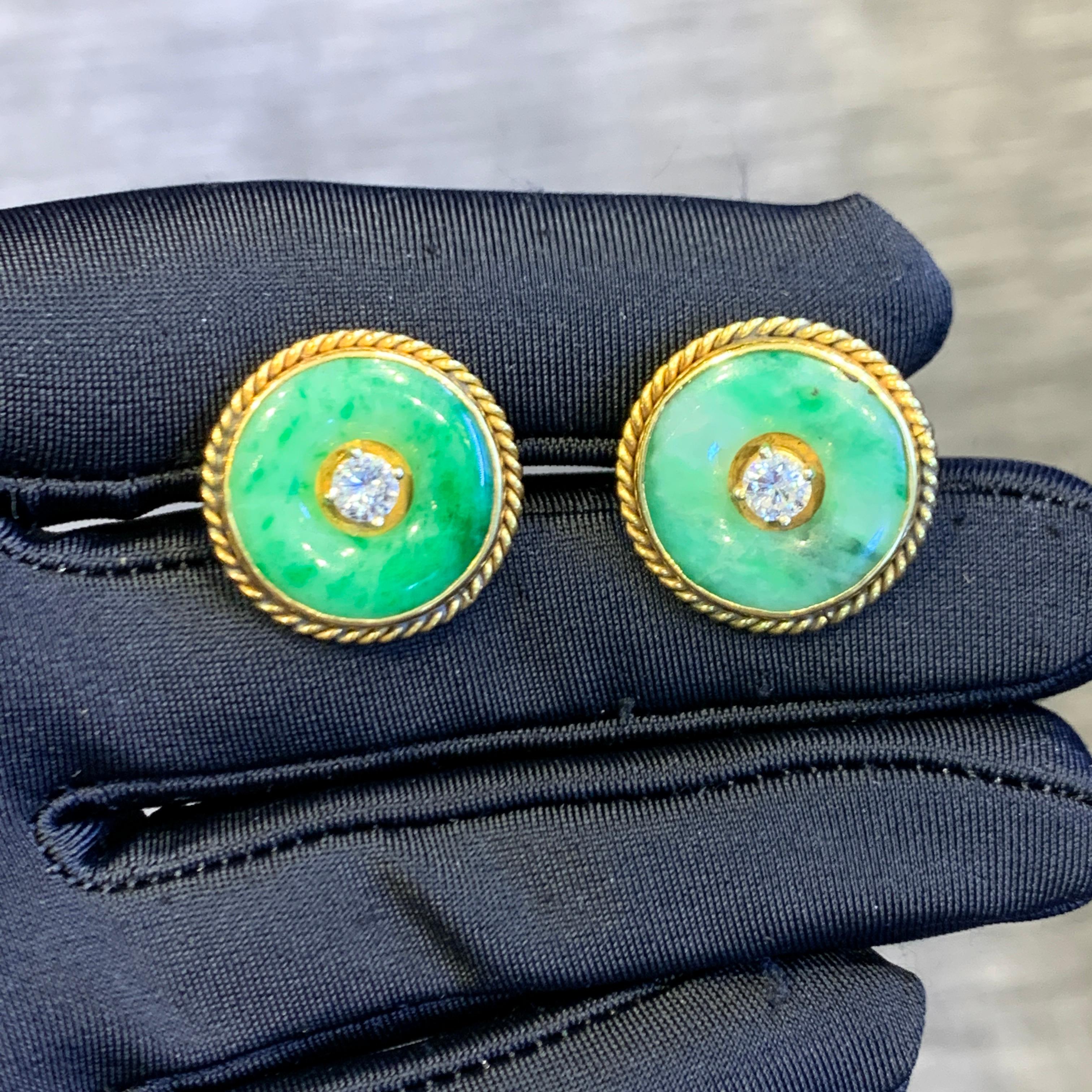 Jade & Diamond Earrings

A pair of 14 karat yellow gold earrings each set with a central round cut diamond framed by a circular jade 

Diameter: 0.82
