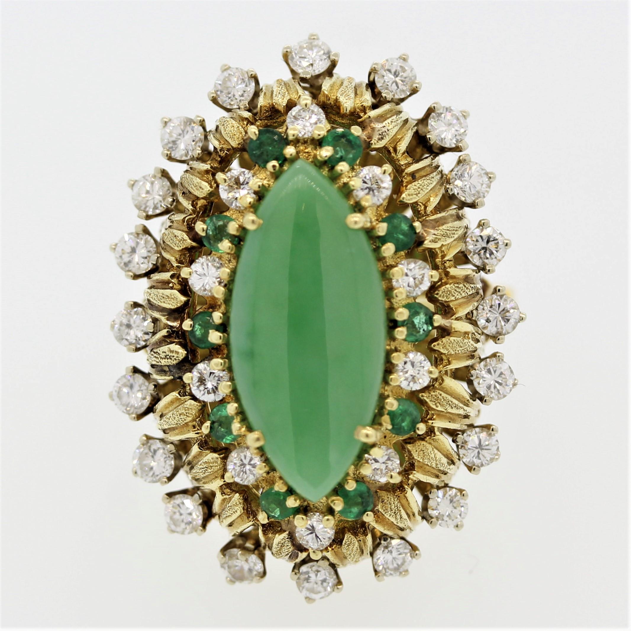 A wonderfully unique ring featuring an approximately 4 carat piece of green jade in a navette shape. It is accented by 1.50 carats of round brilliant cut diamonds along with 0.30 carats of round cut emeralds. Made in 18k yellow gold, this navette